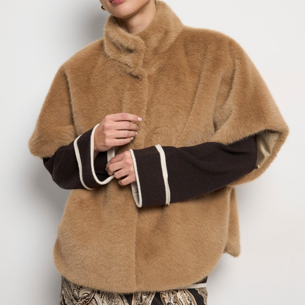Bariloche Aris camel faux fur elbow sleeve cape coat styled on model