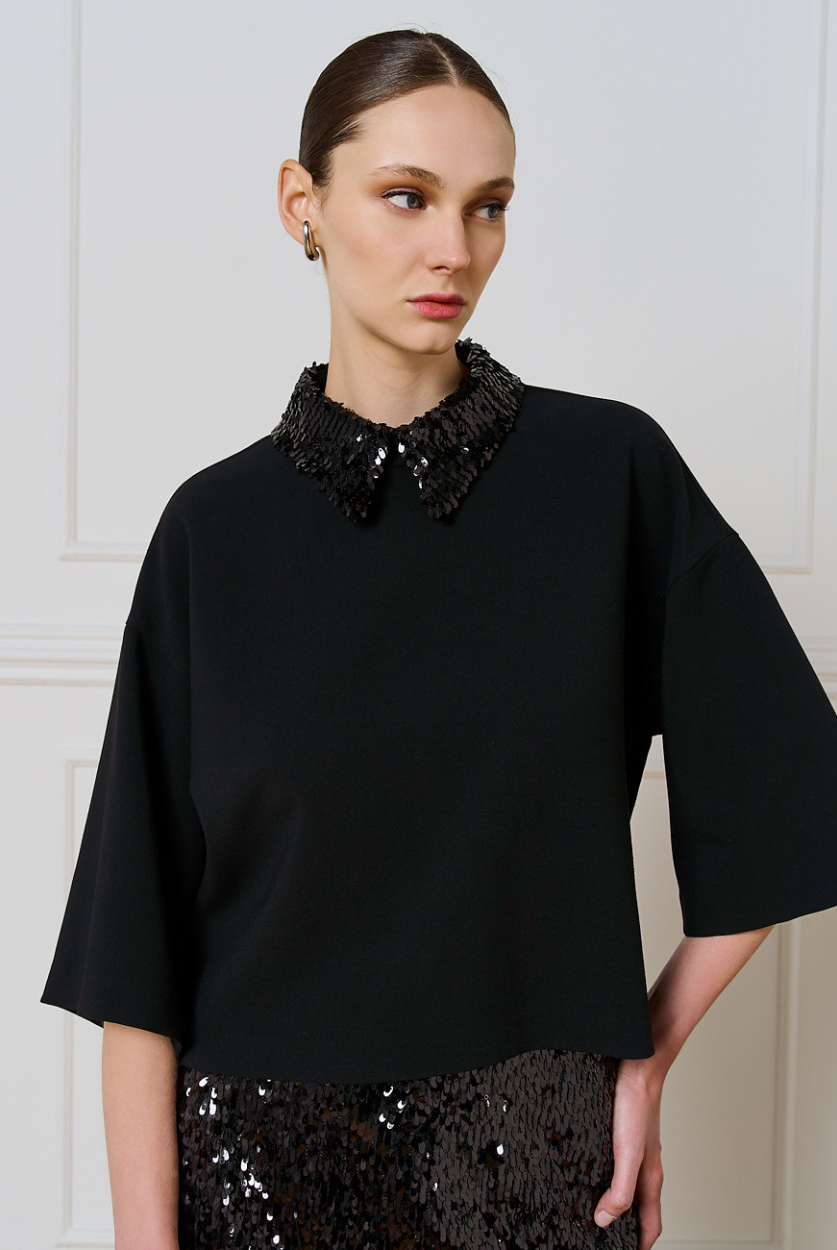 Access Fashion relaxed black top with wide 3/4 sleeves and detachable sequin collar, front three-quarter view.