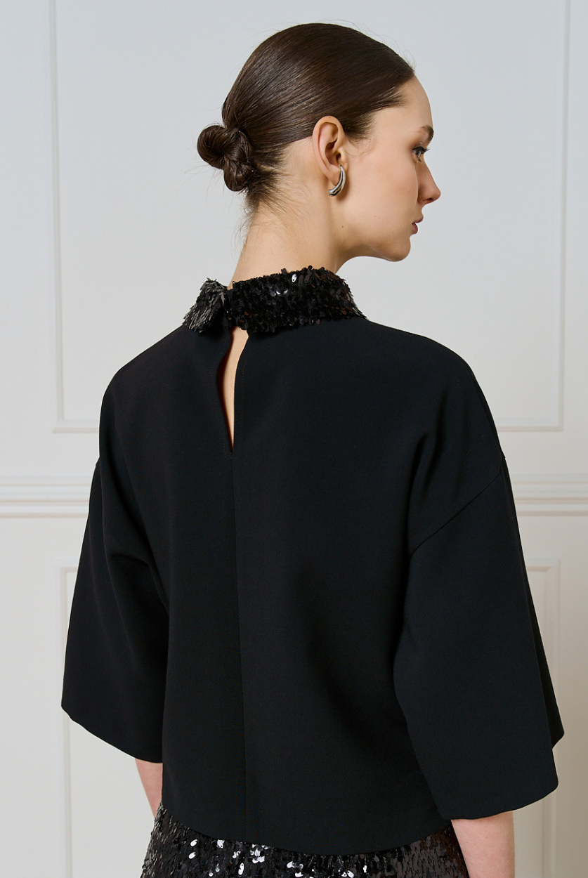 Access Fashion black top back view showing keyhole opening and detachable sequin collar.