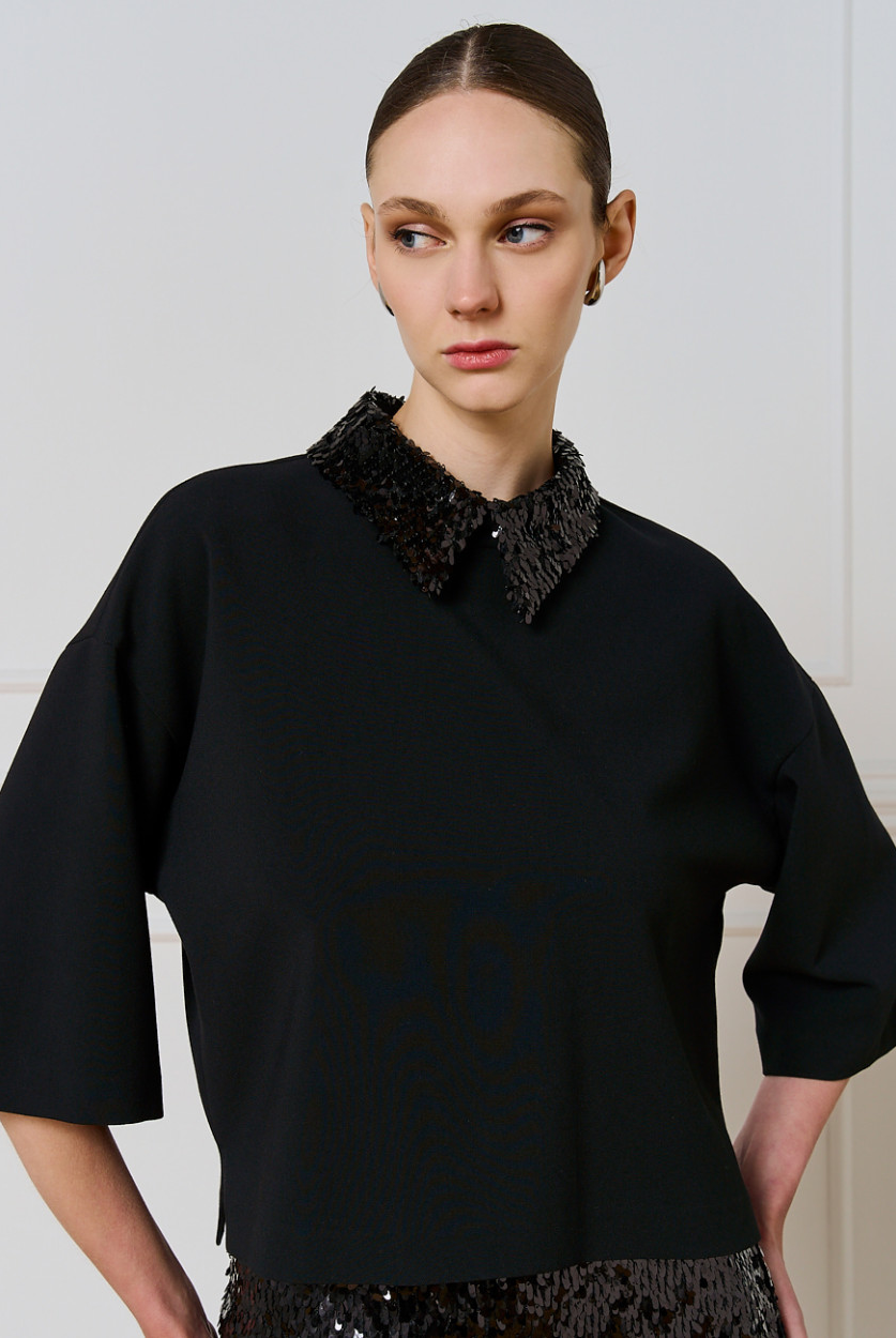 Access Fashion black top with detachable sequin collar and wide 3/4 sleeves, front view on model.