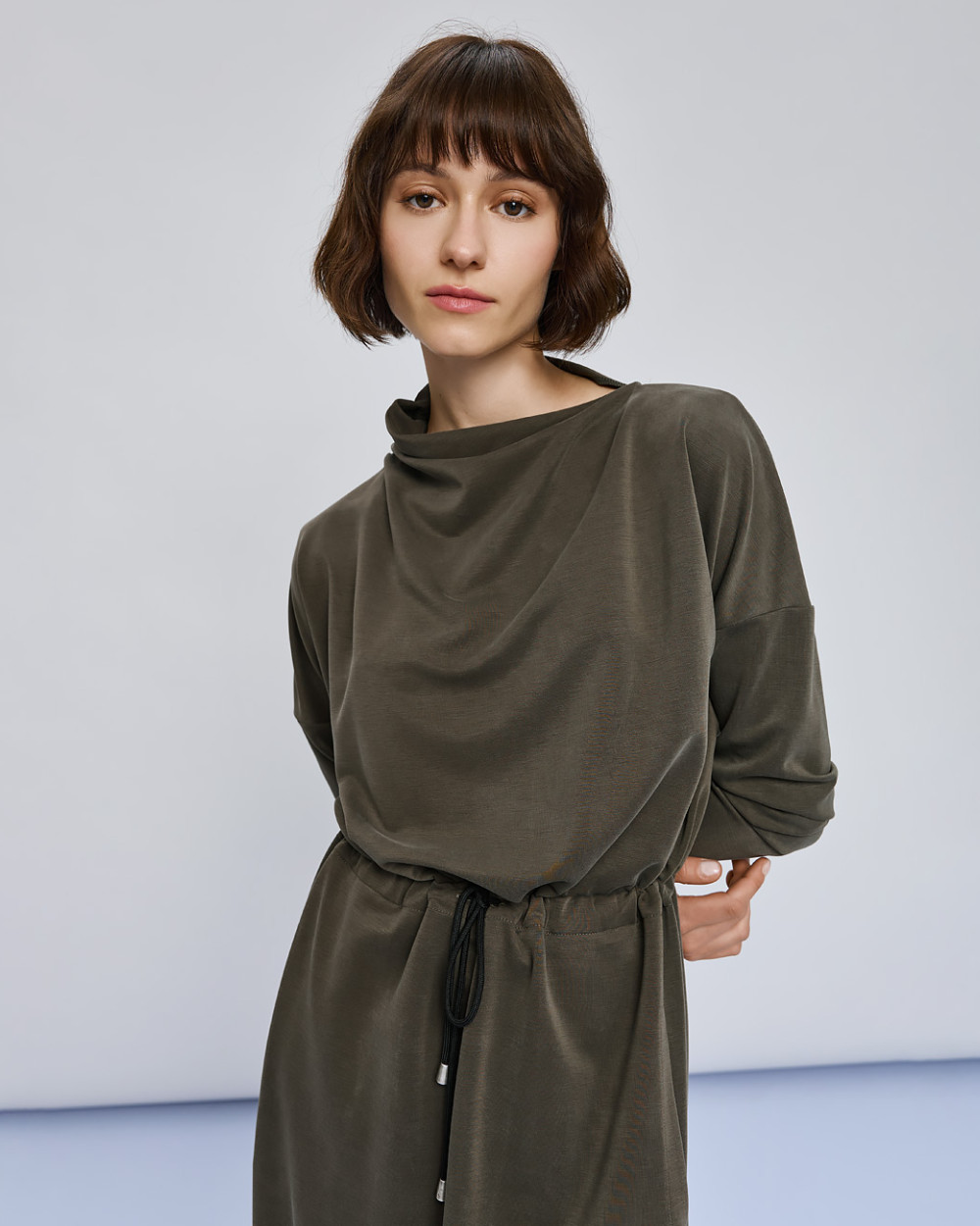 Access Fashion khaki dress close up of draped turtleneck and drawstring waist detail