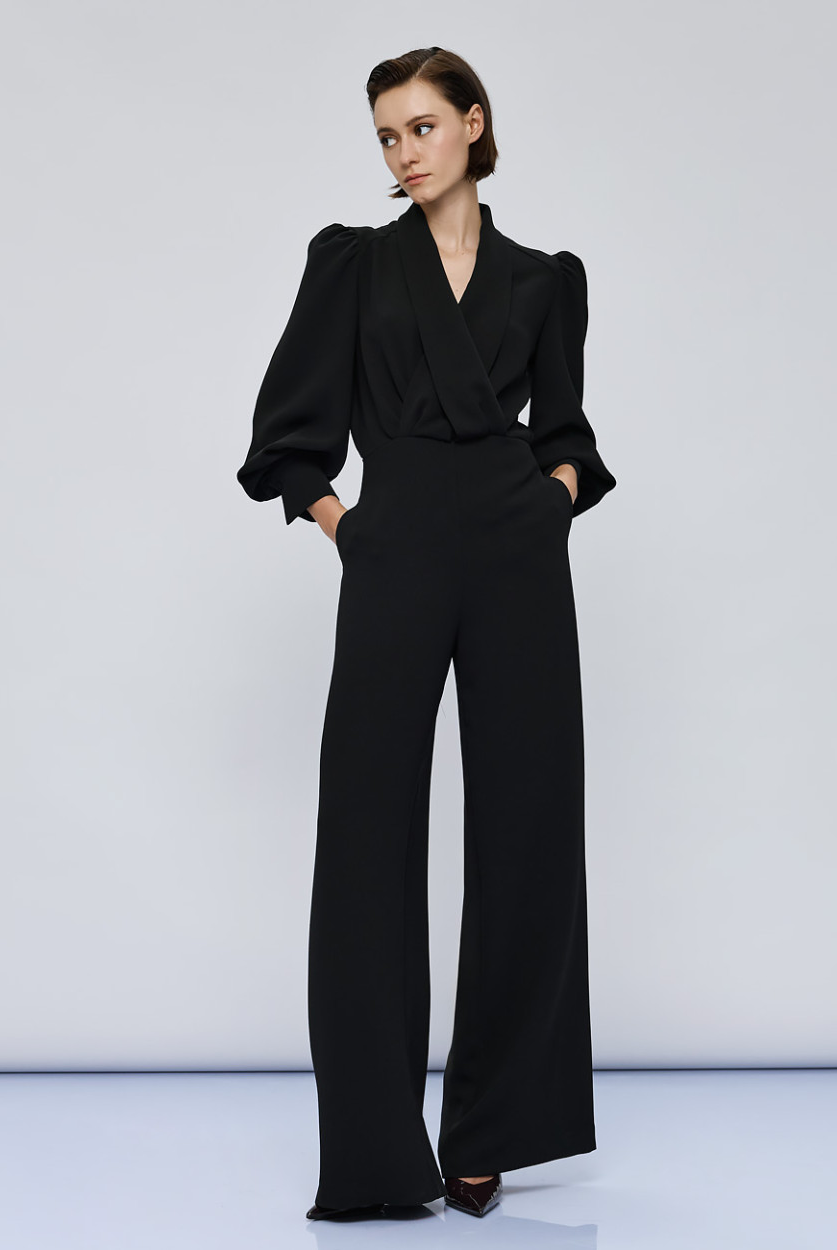 Access Fashion Black Puff Sleeve Jumpsuit back view with keyhole opening and long wide legs.