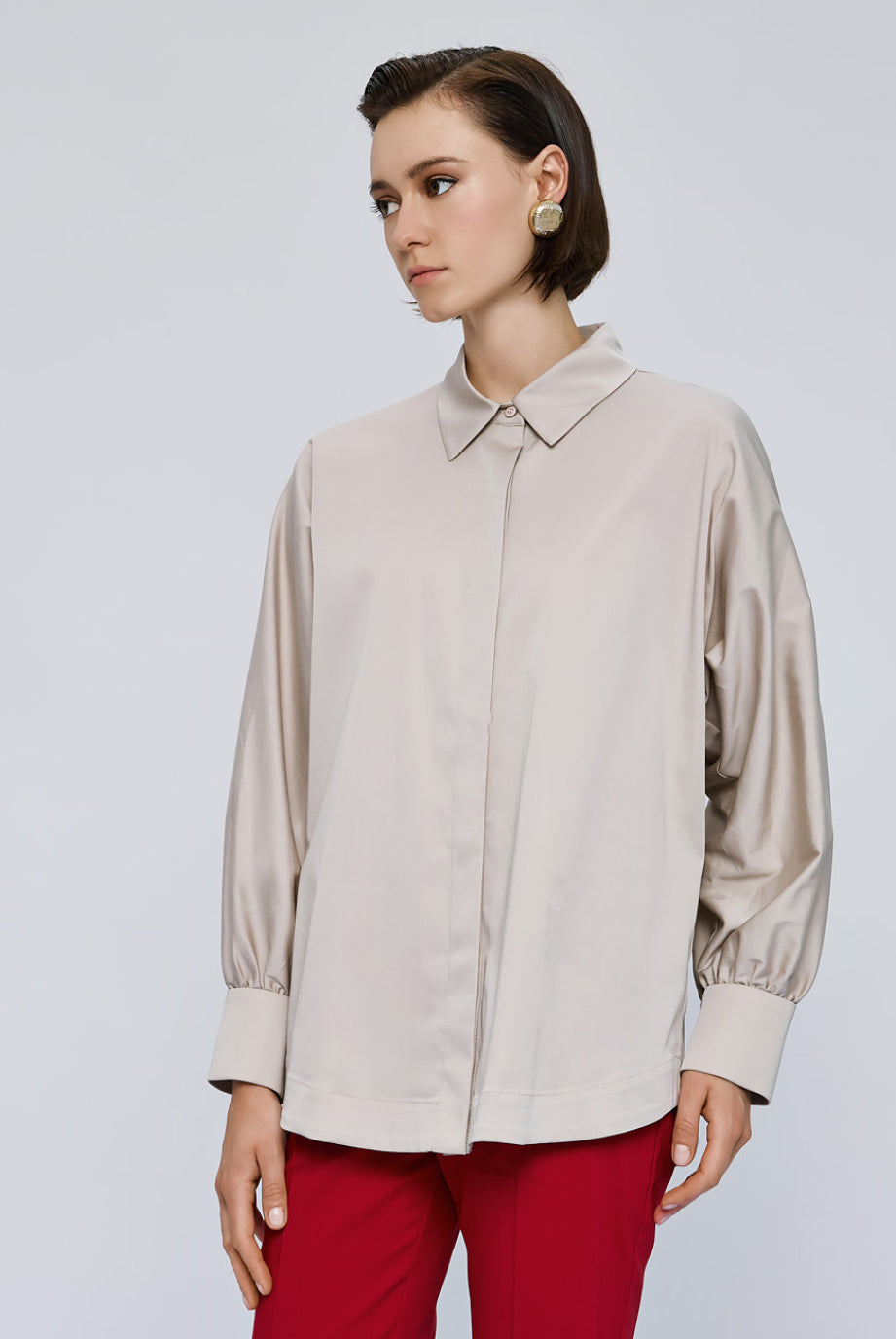 Access Fashion cream shirt styled with red trousers