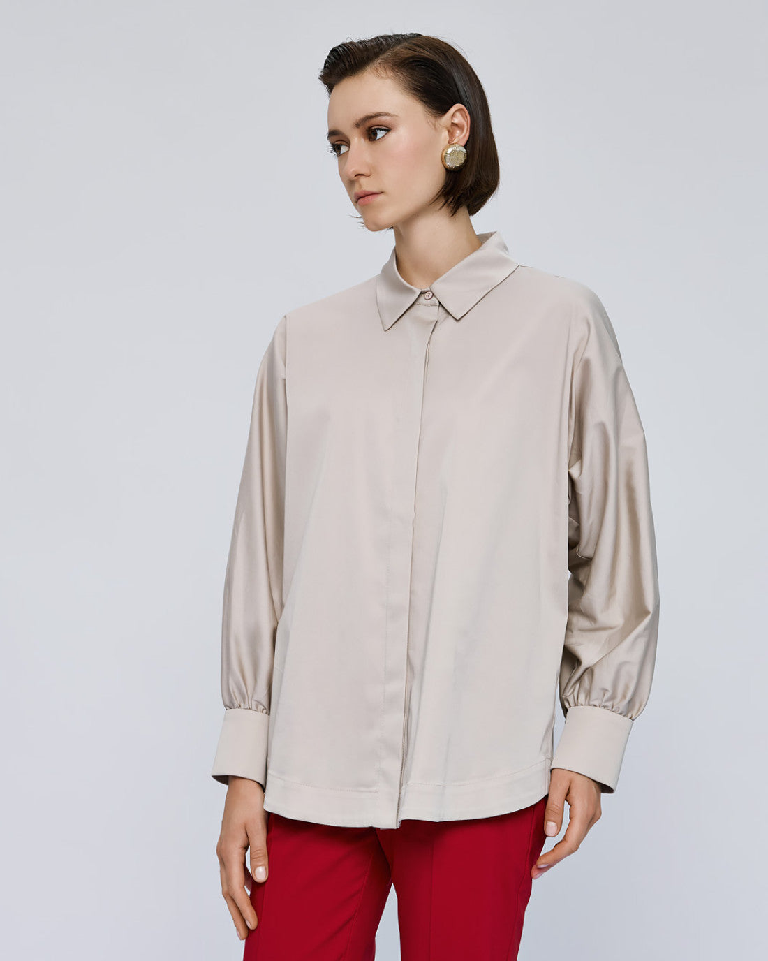 Access Fashion cream shirt styled with red trousers