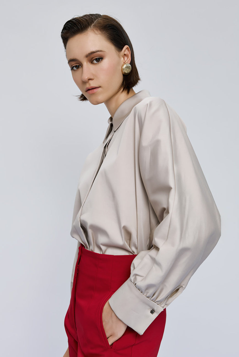 Side view of Access Fashion cream shirt with gathered cuff