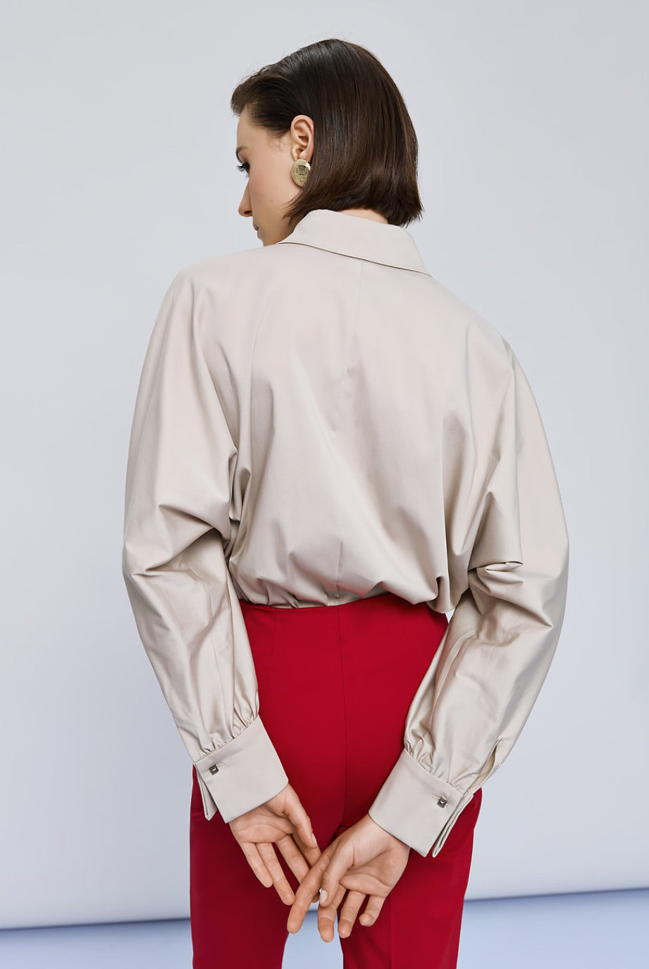 Back view of Access Fashion beige shirt with gathered cuff