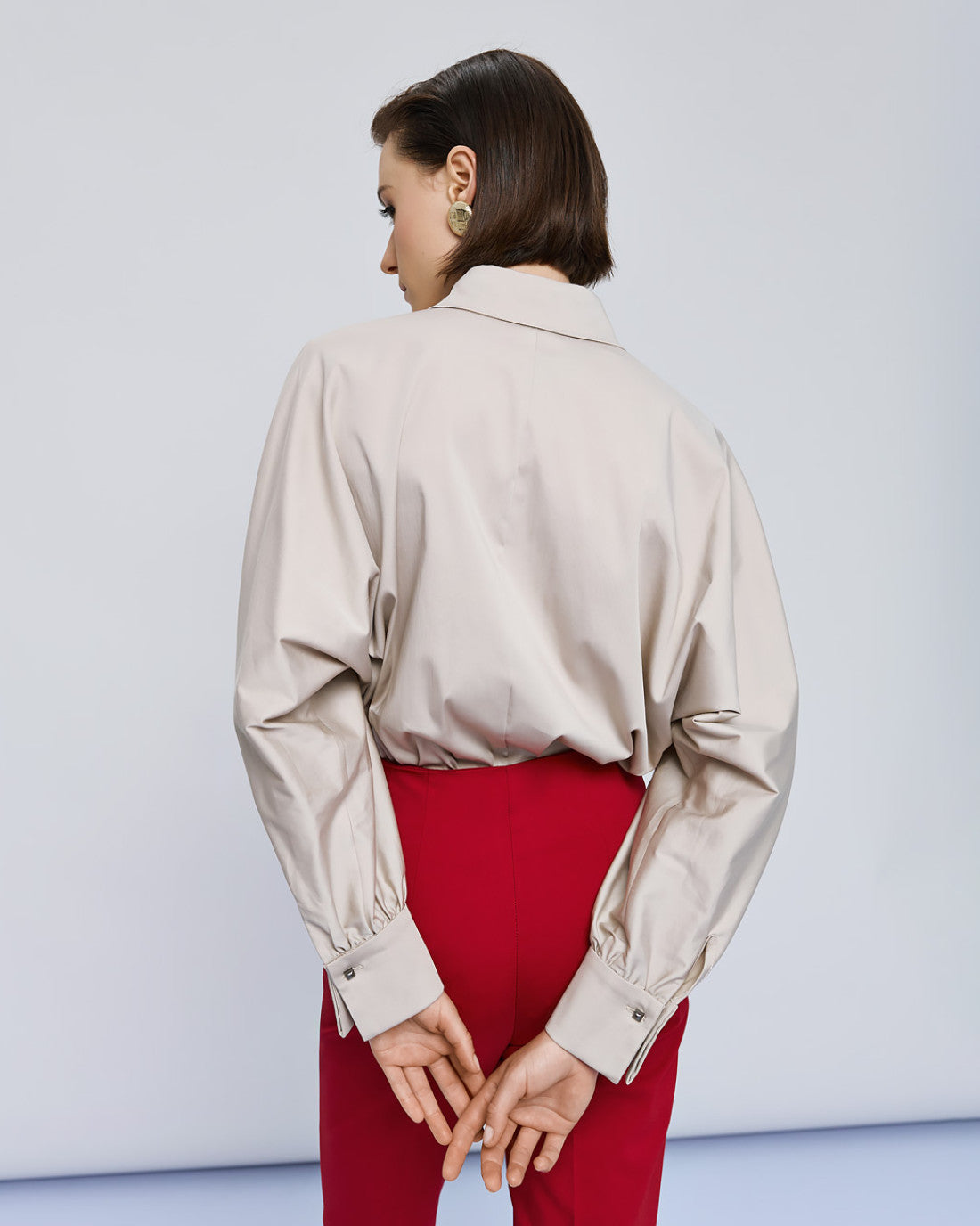 Back view of Access Fashion beige shirt with gathered cuff