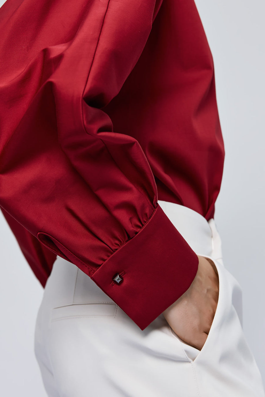 Back of Access Fashion red shirt with long sleeves and cuff detail