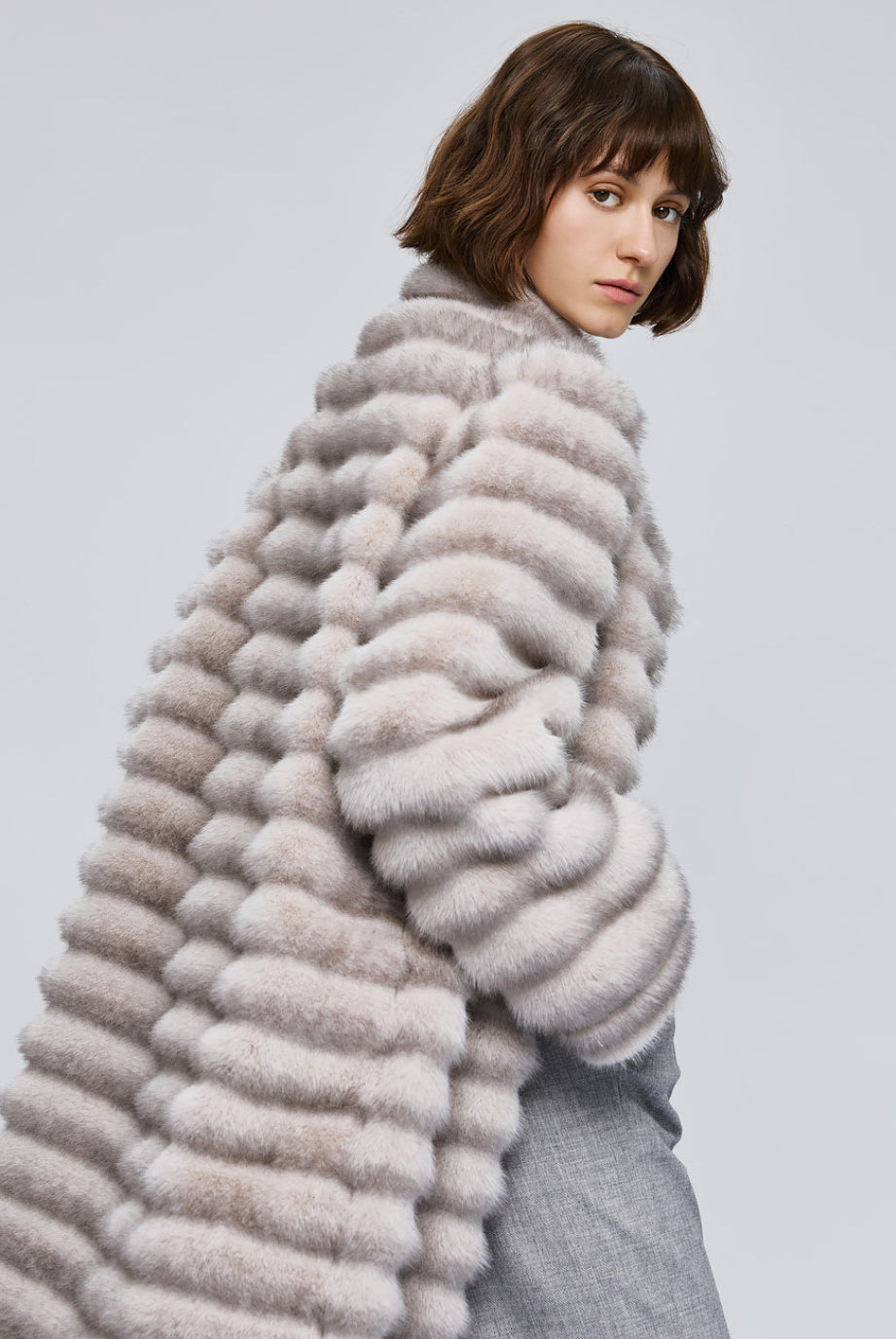 Access Fashion long grey faux fur coat three quarter side view, cosy high neck and pockets