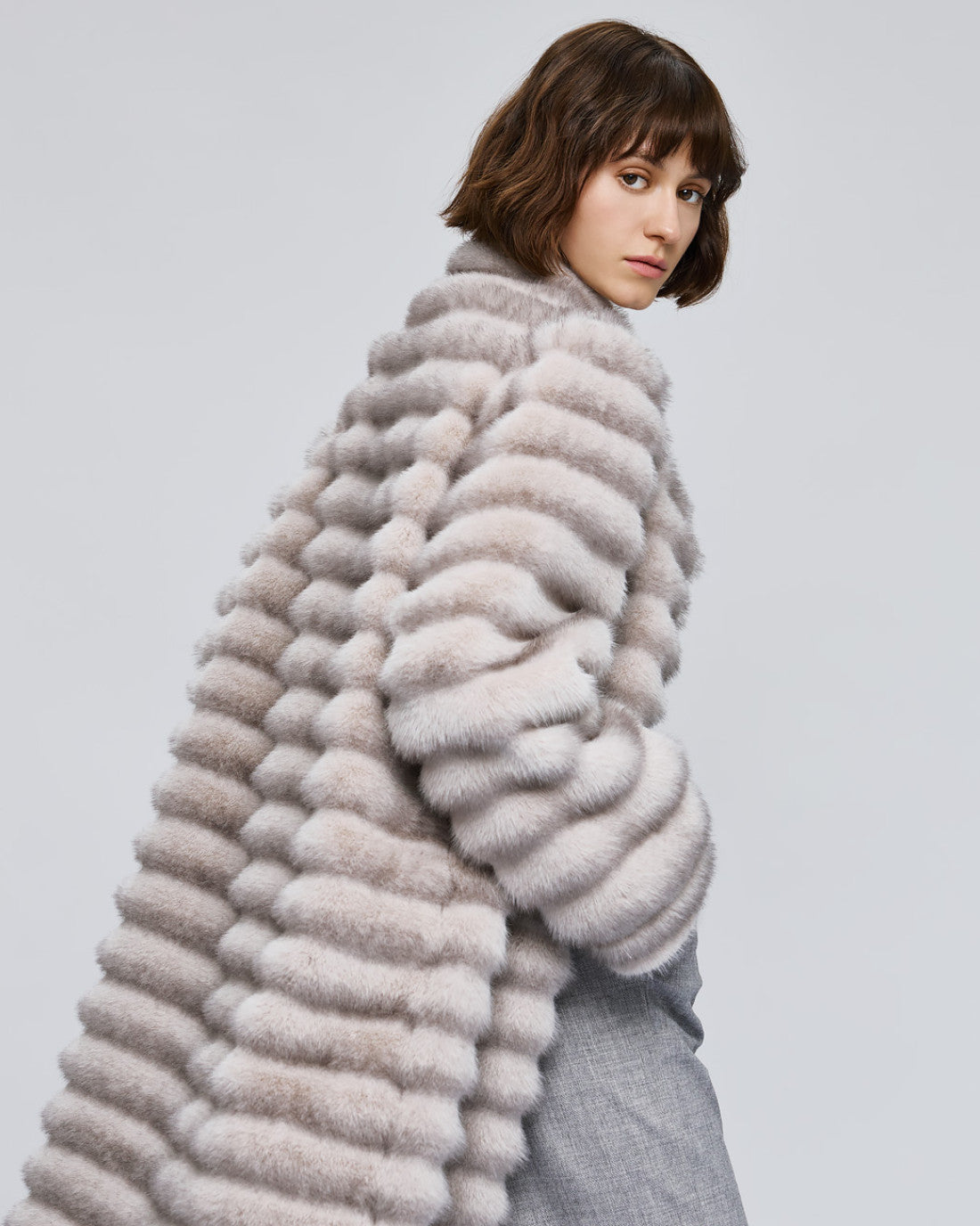 Access Fashion long grey faux fur coat three quarter side view, cosy high neck and pockets