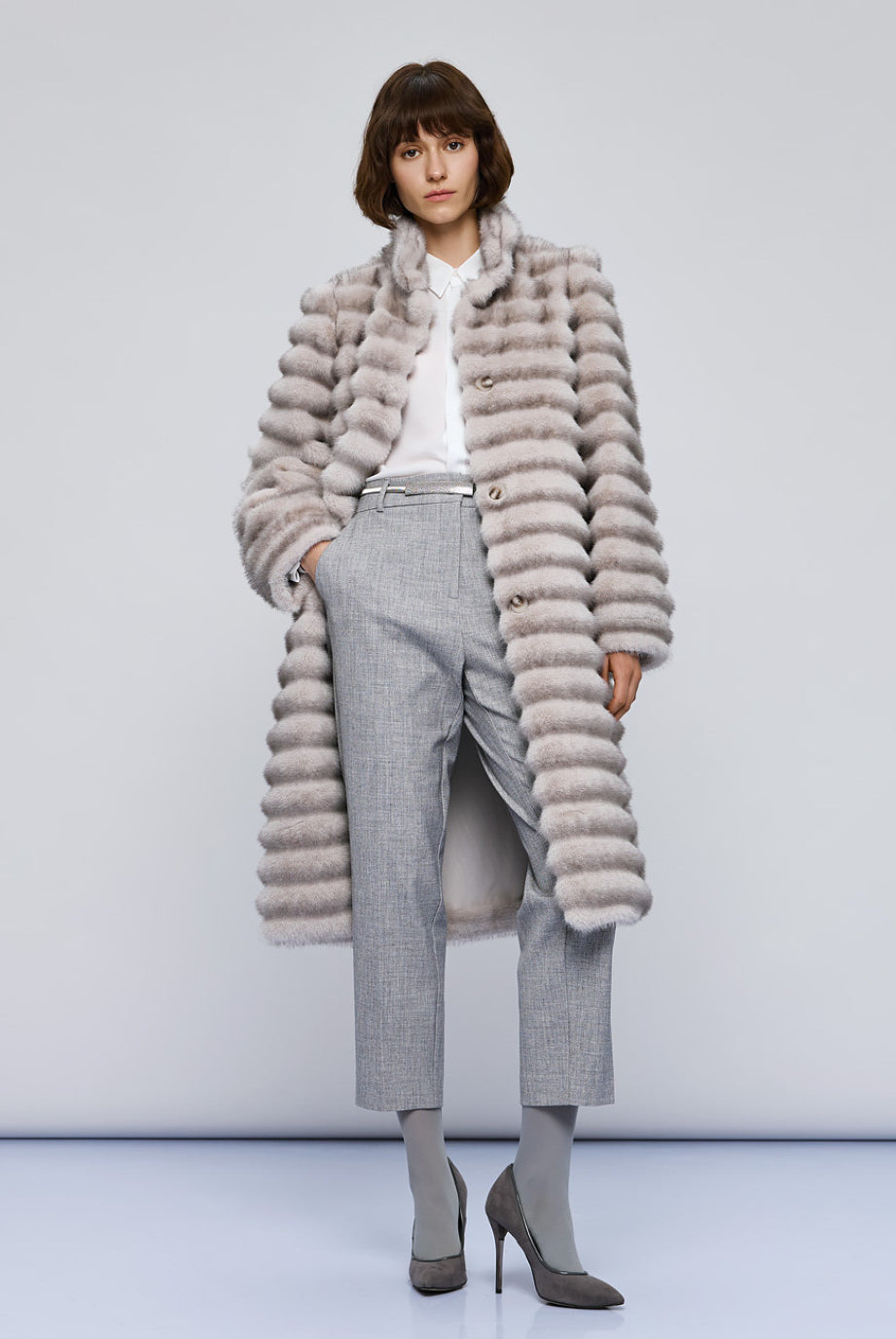 Access Fashion long grey faux fur coat on model, front view styled with grey trousers and heels