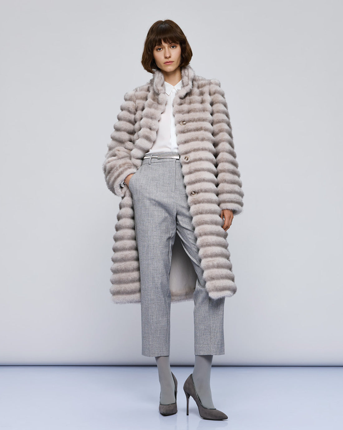 Access Fashion long grey faux fur coat on model, front view styled with grey trousers and heels