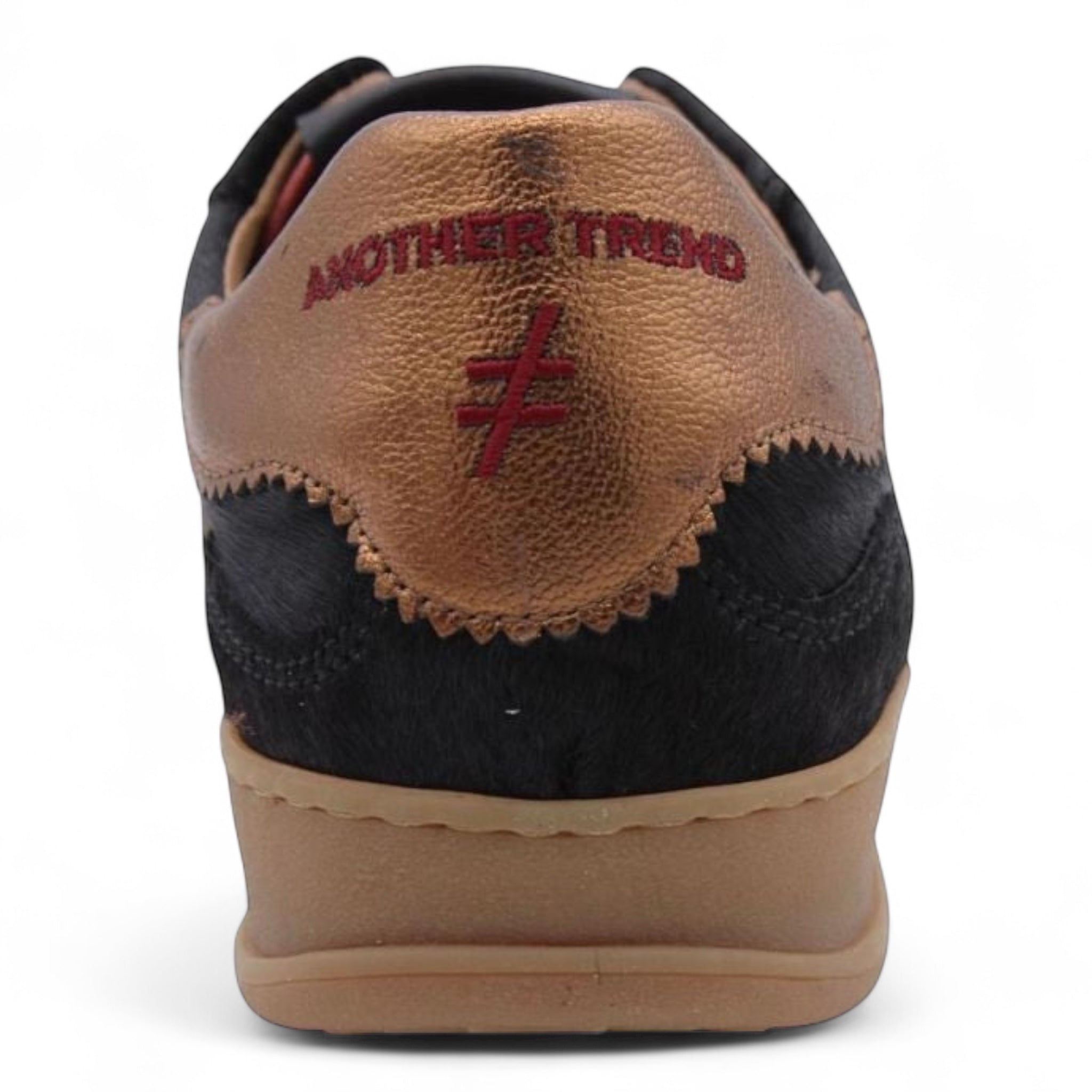 Back view of Another Trend Iconic Trainers with bronze heel tab and red embroidered logo