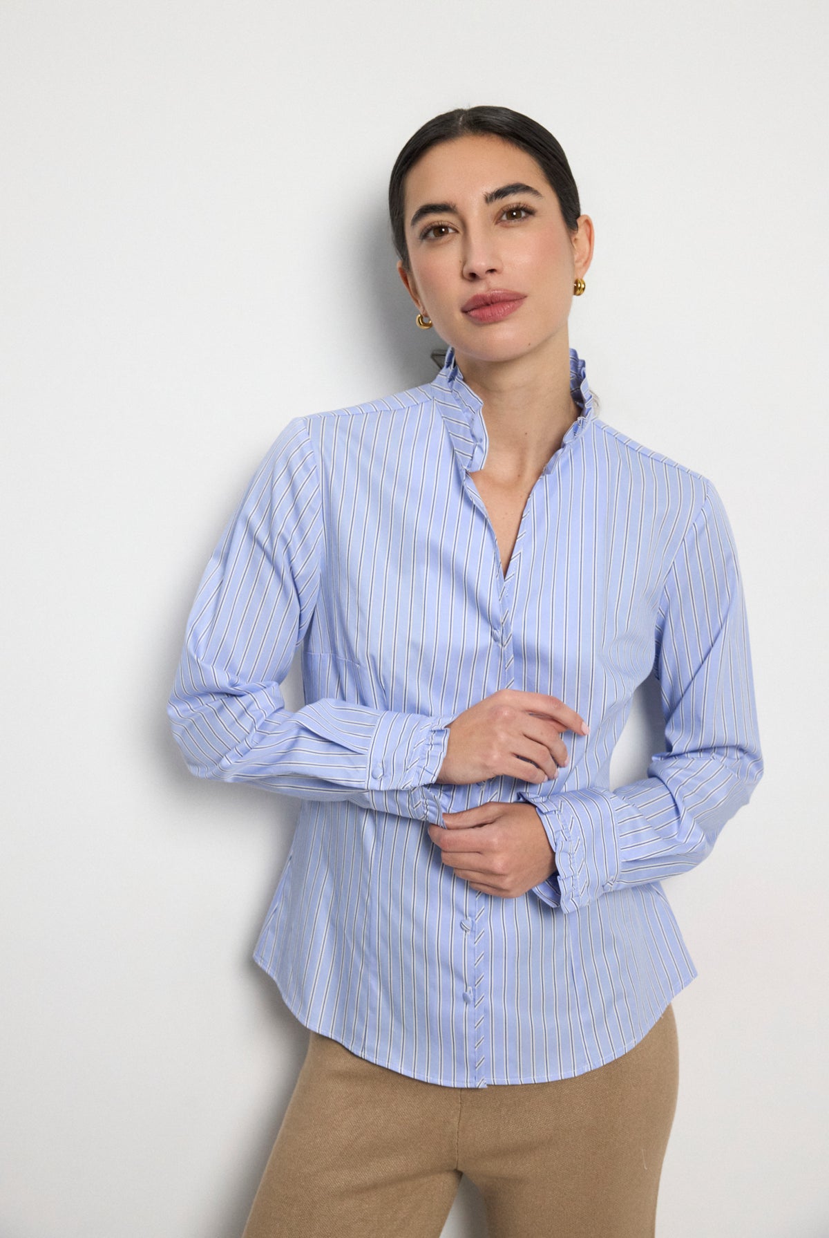 Bariloche Adrano blue pinstripe ruffle collar shirt front view on woman