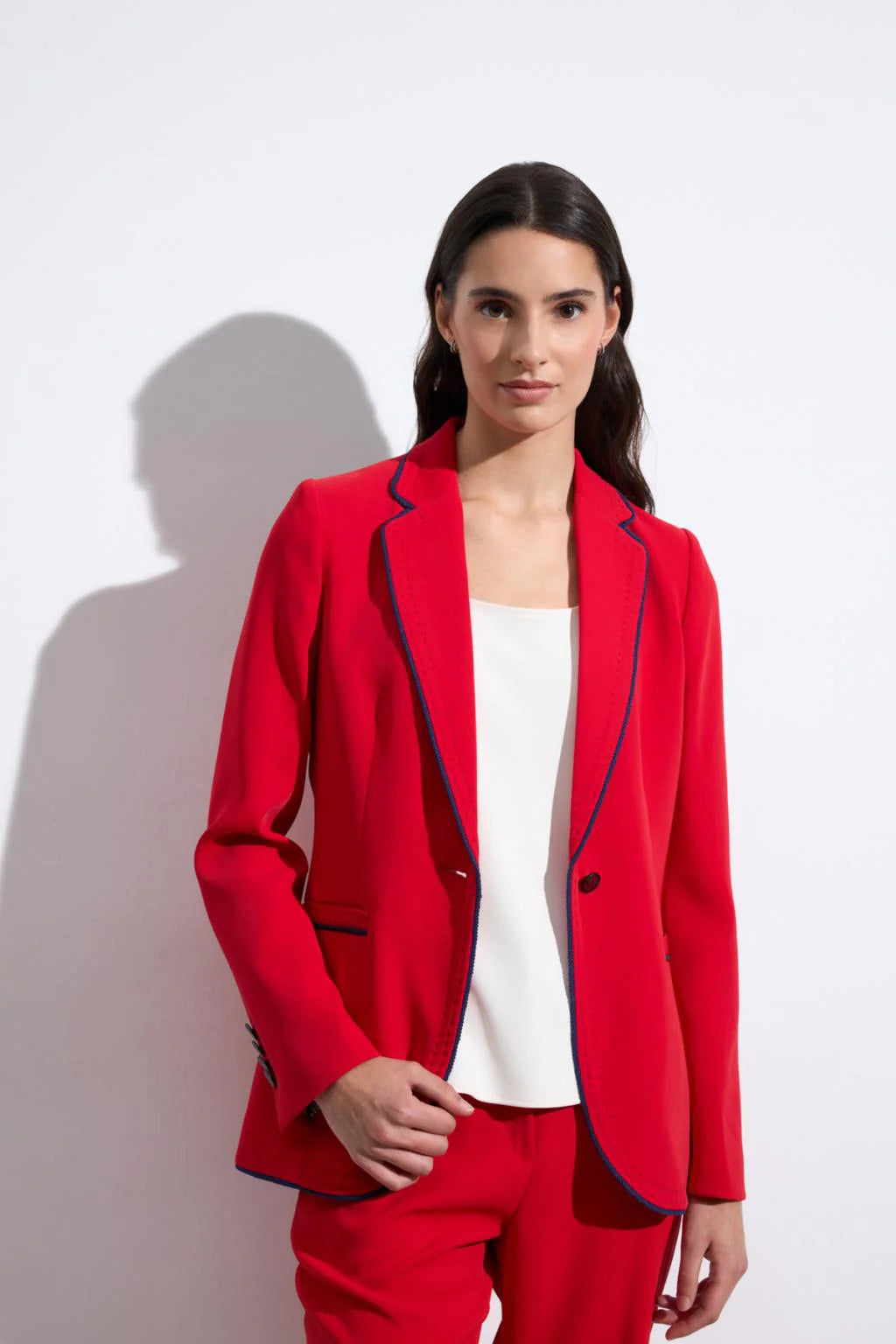 Bariloche Aljariz red blazer with navy trim front view