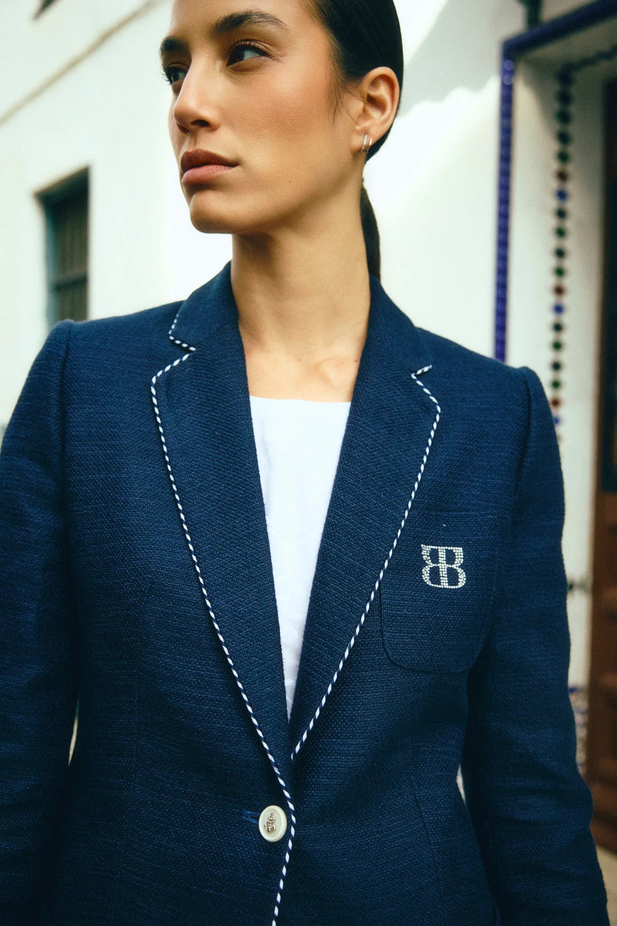 Bariloche Hidra navy blazer lapel piping detail