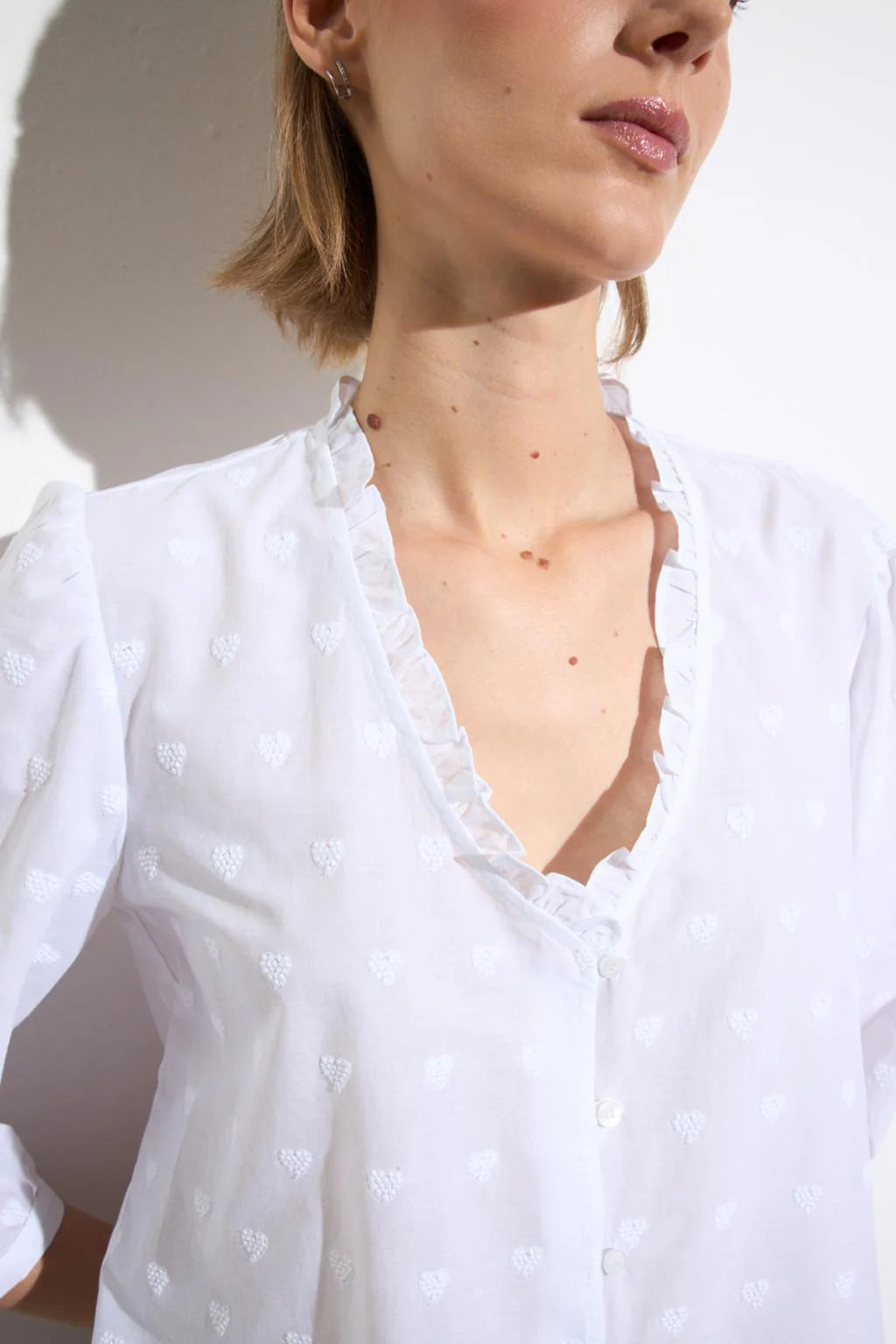 Bariloche white blouse heart embroidery frill neckline detail