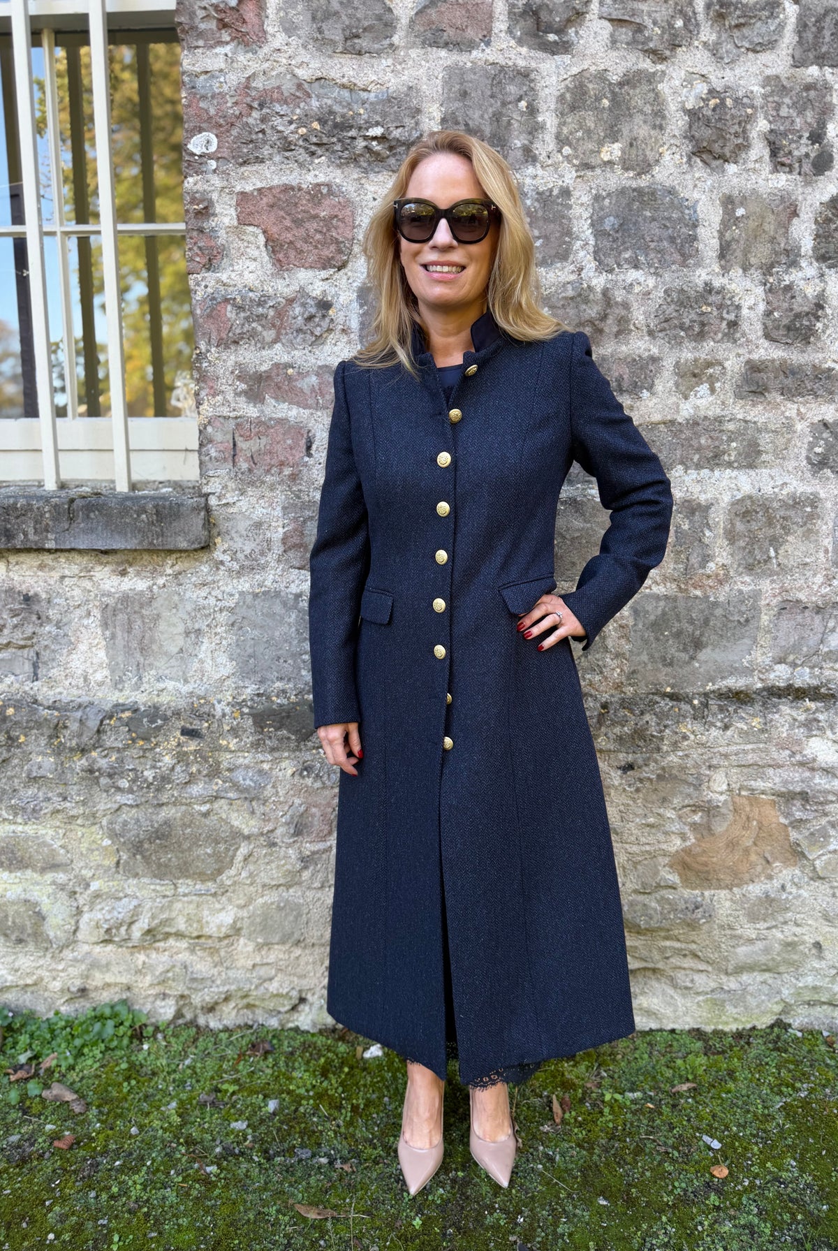 LBariloche Valent navy long herringbone coat with fitted waist and gold buttons – front lifestyle view