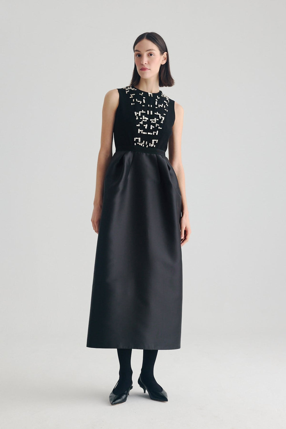 Front view of black crystal embellished midi occasion dress