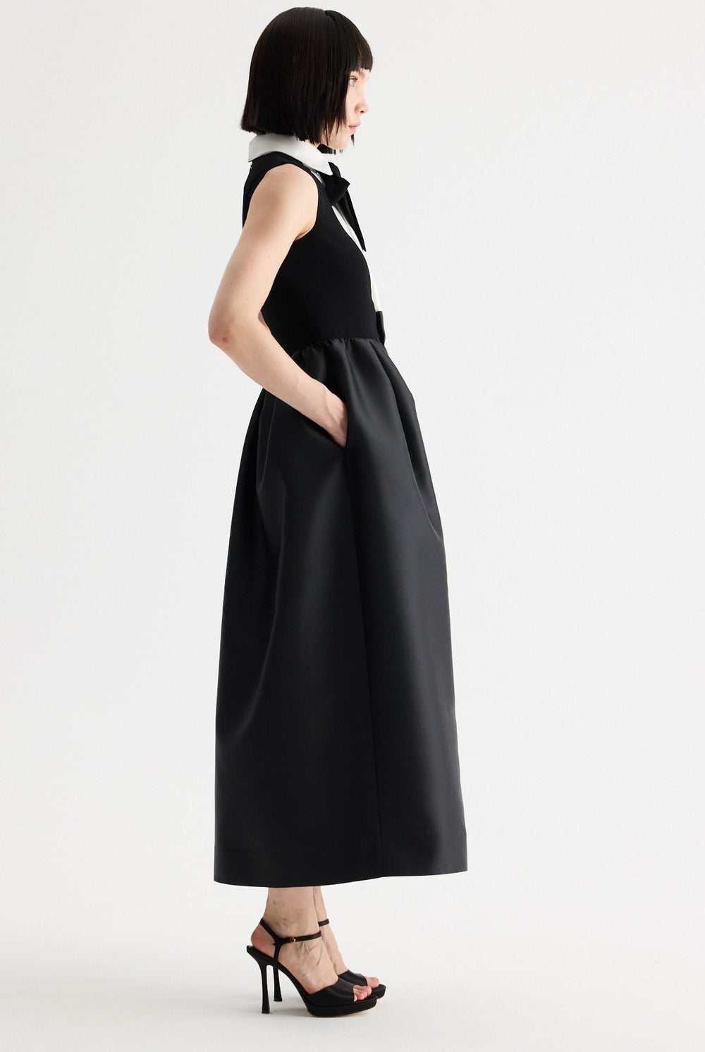 Birelin Couture black and white sleeveless occasion dress with full tulipskirt