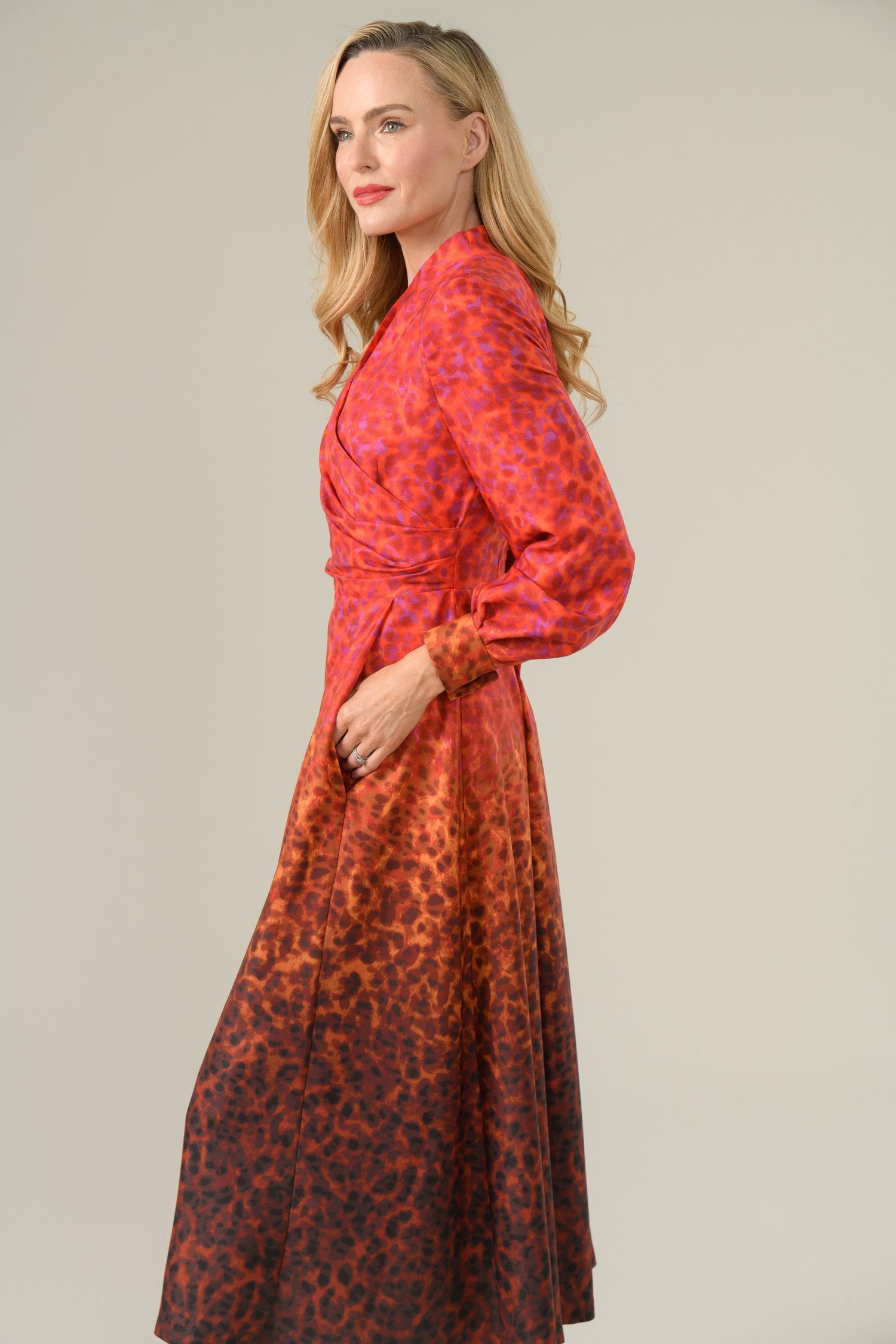 Side profile of model in Caroline Kilkenny red ombré occasion dress