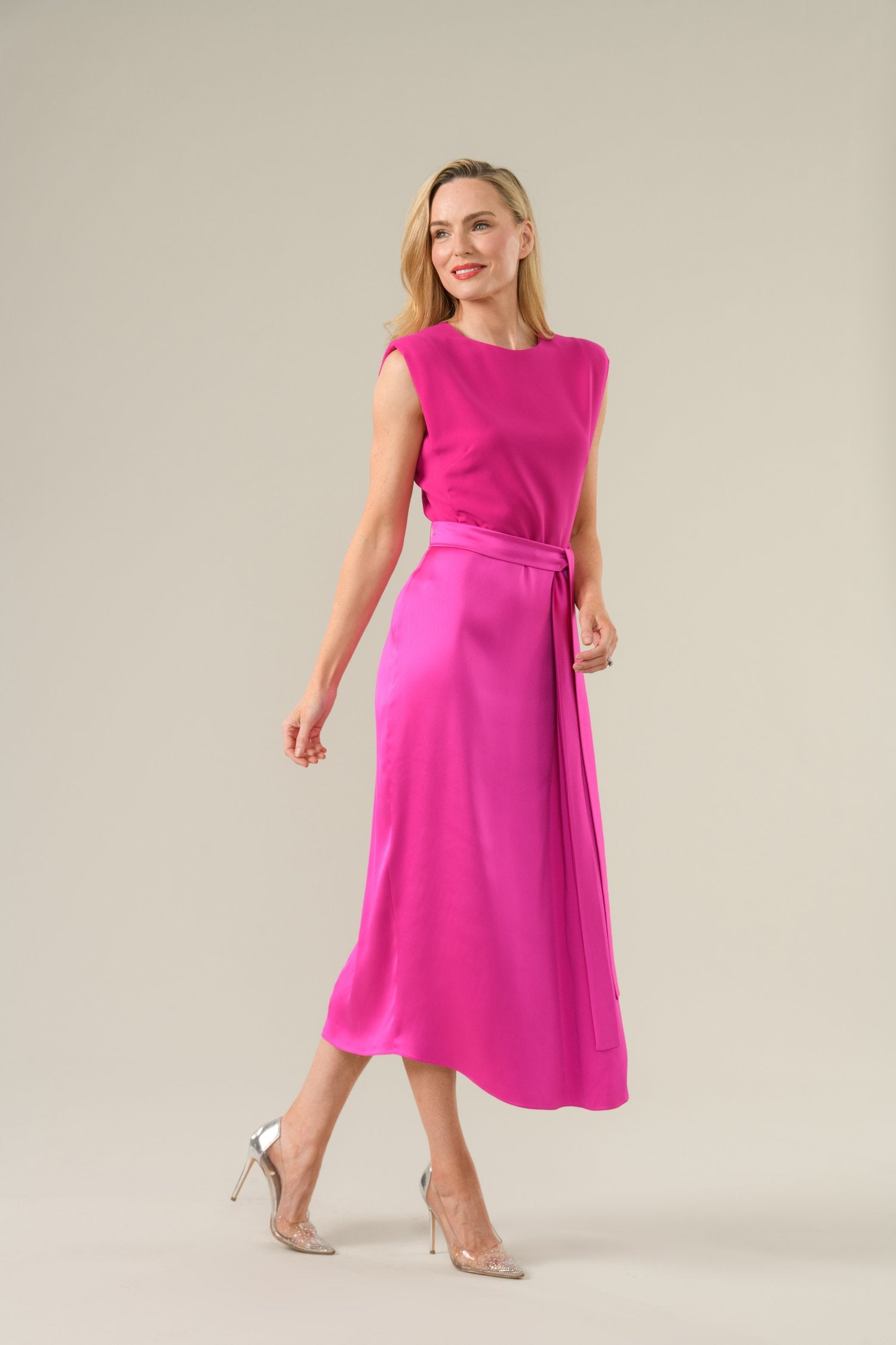Model wearing Caroline Kilkenny Grace midi dress in cerise front view