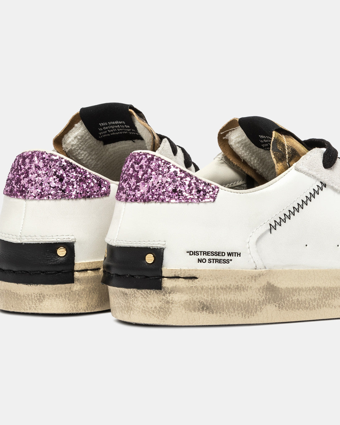 Crime London gold rush trainers showing distressed text and purple glitter heel detail