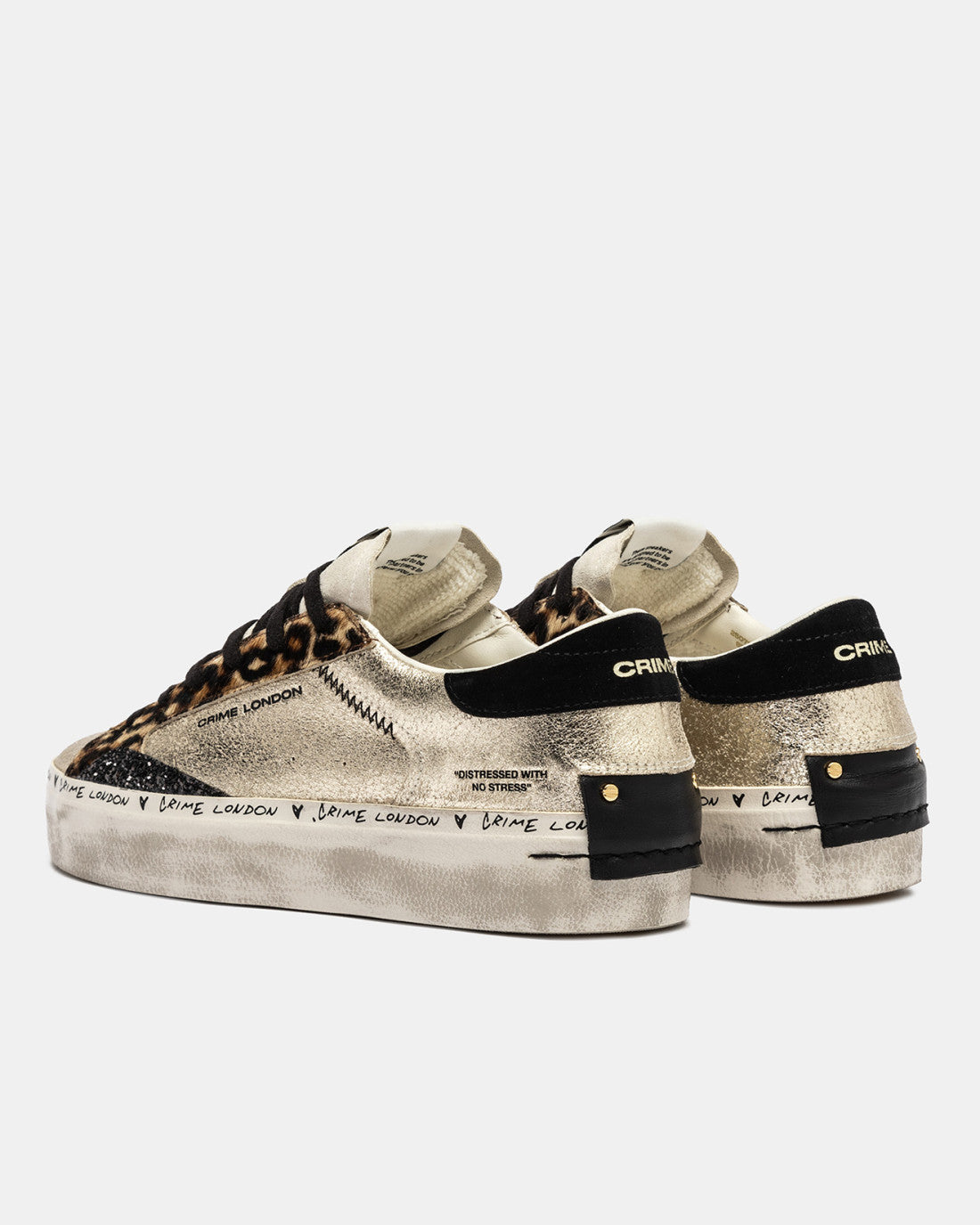 Side view of Crime London gold trainers with platform sole and worn effect