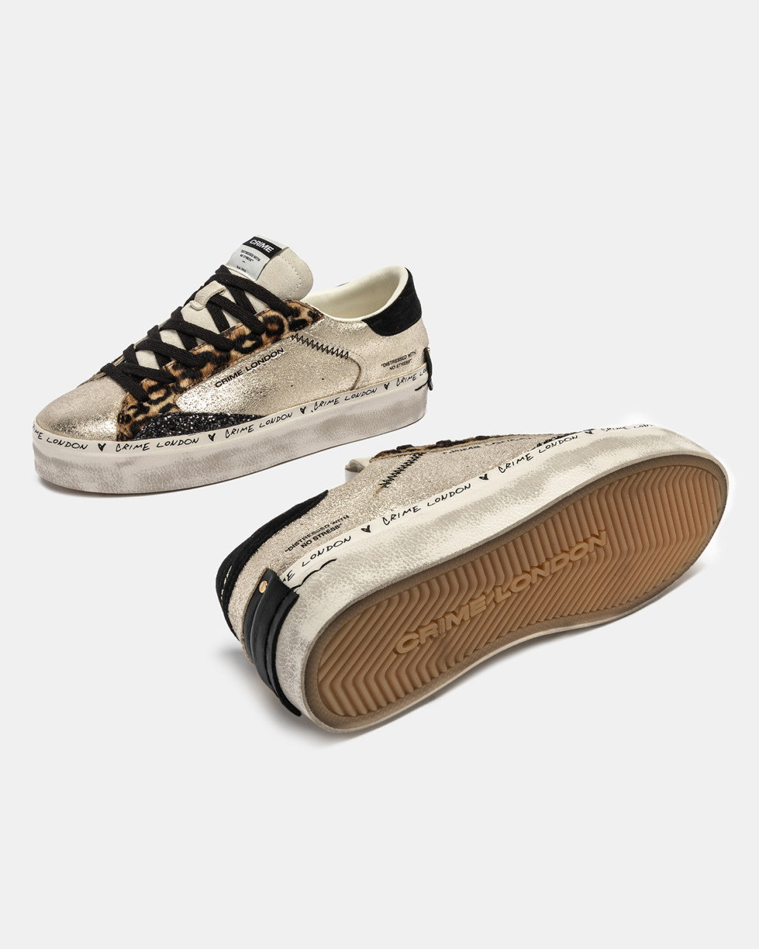 Bottom sole view of gold distressed Crime London platform trainers with beige outsole
