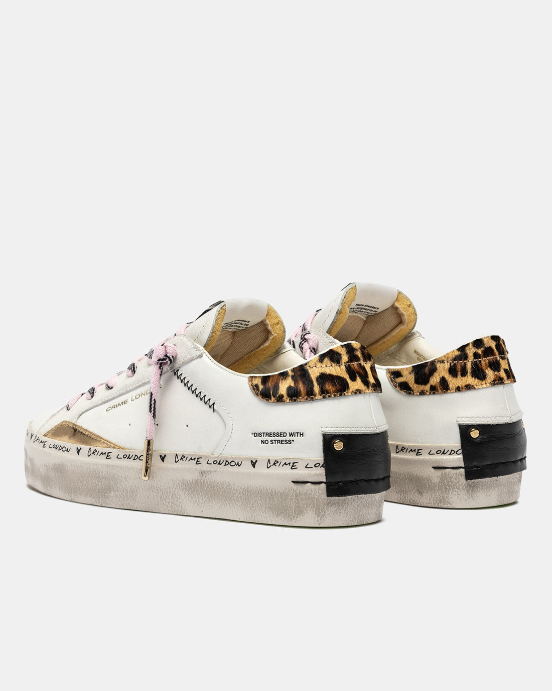 Side view of Crime London trainers with cheetah heel and graffiti text