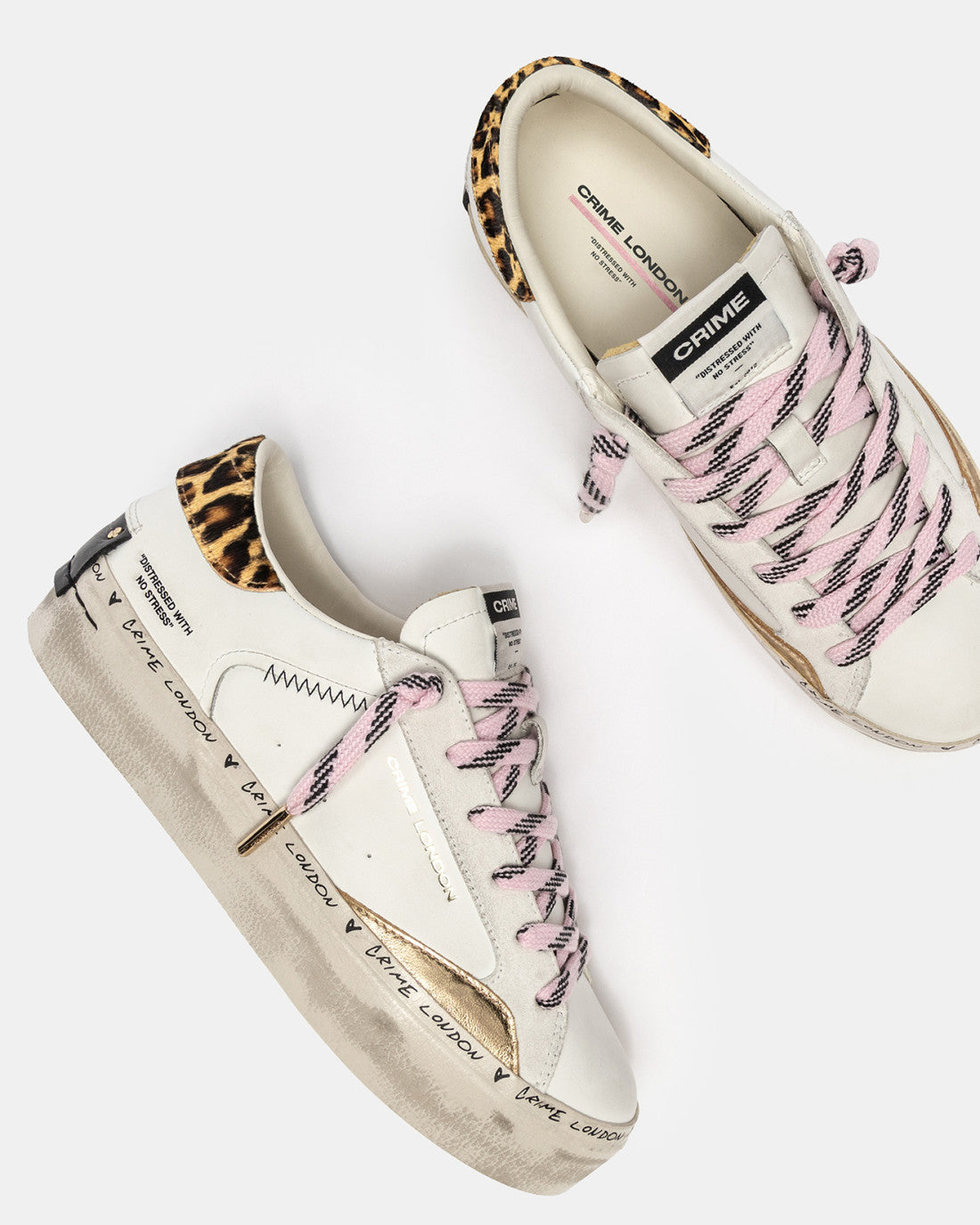 Top-down view showing pink laces and metallic gold side panel