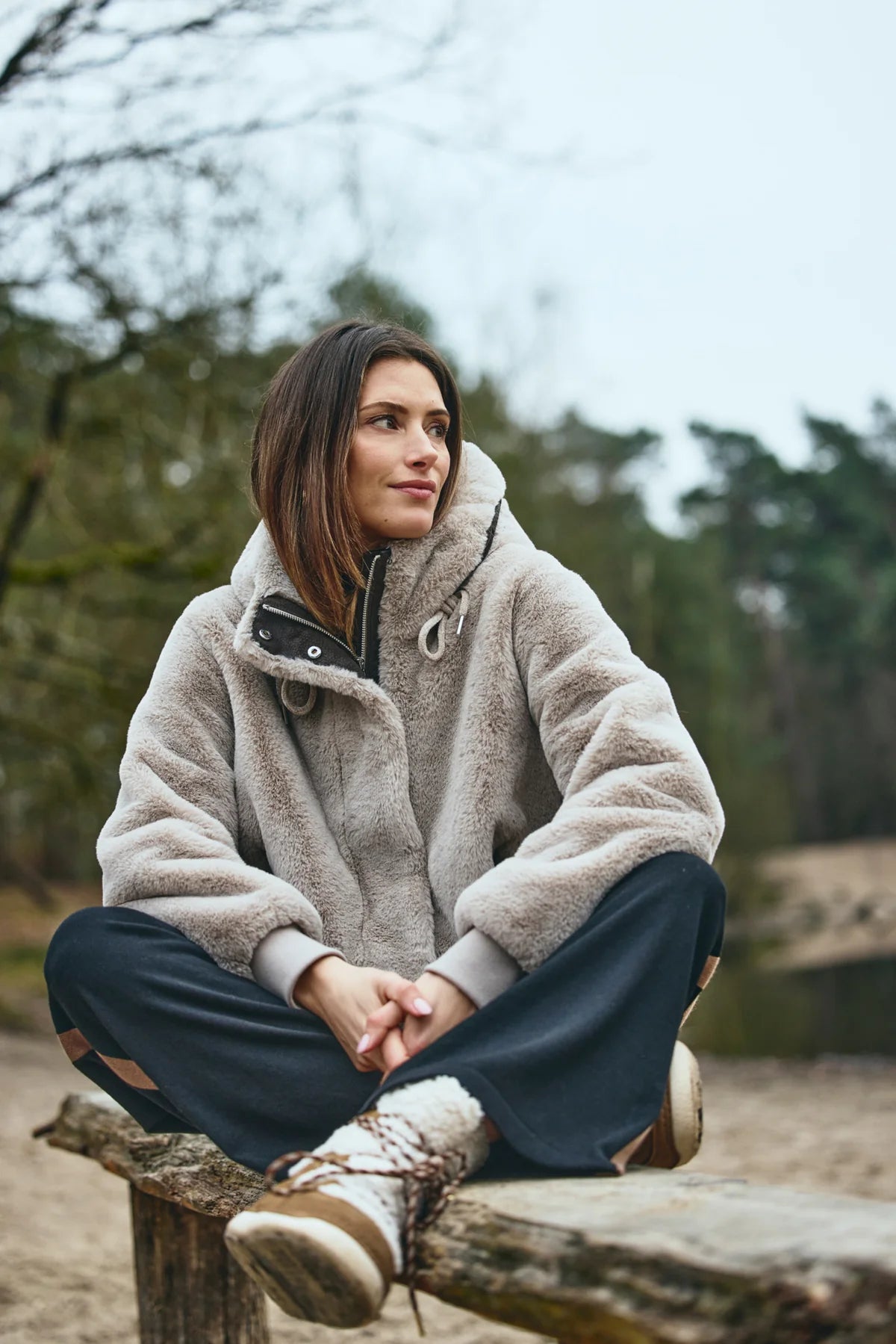 District Bonbon light sand teddy jacket with adjustable hood – modelled outdoors