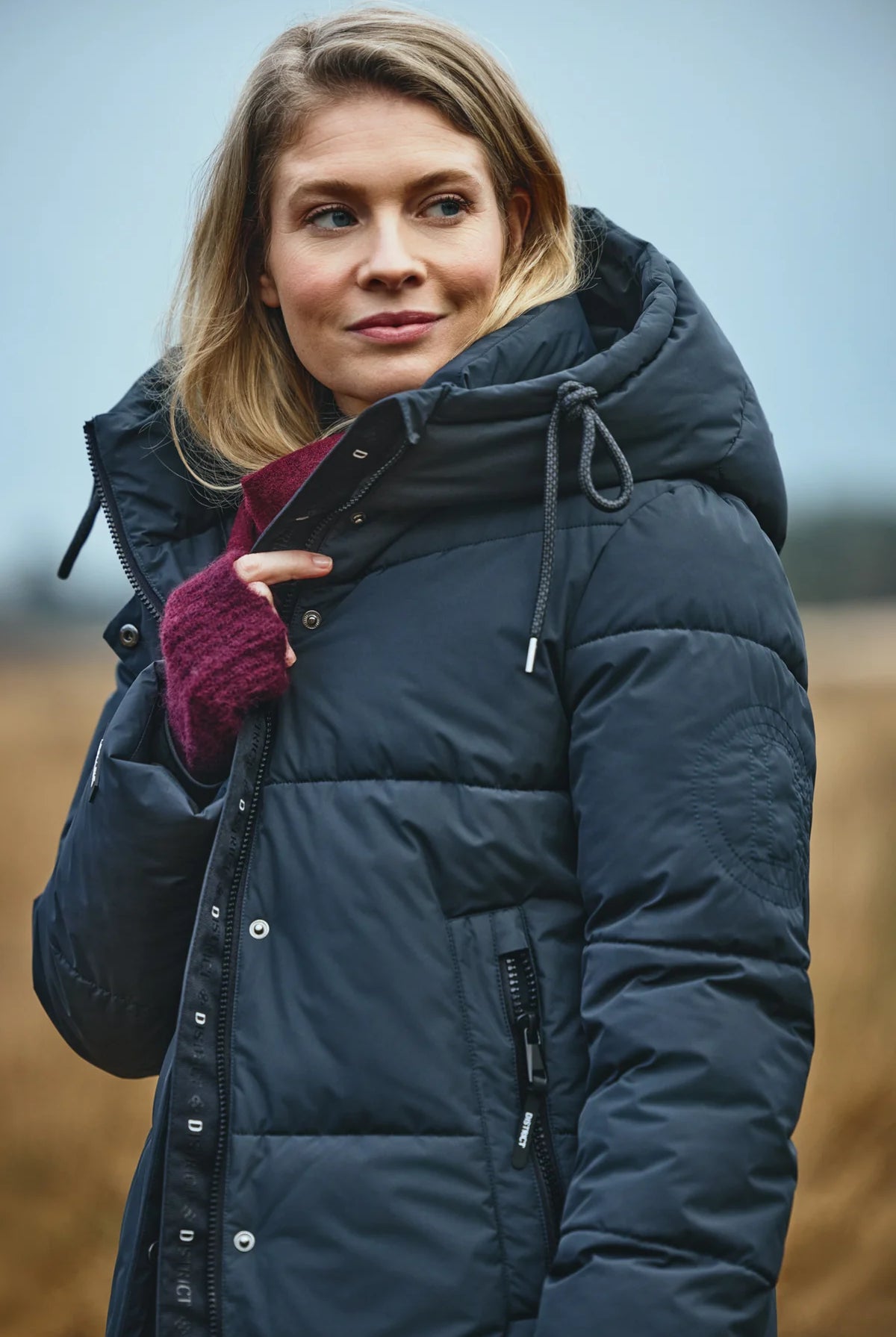 District Lungo long hooded padded coat back view showing quilted silhouette