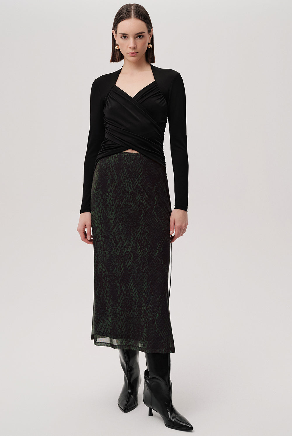 Exquise Linda K animal print skirt – side view showing sheer hem and boots