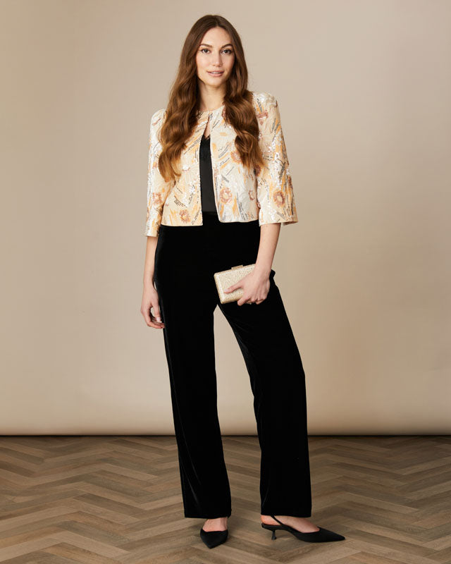 Fee G Athena short beaded jacket styled over tailored evening outfit.