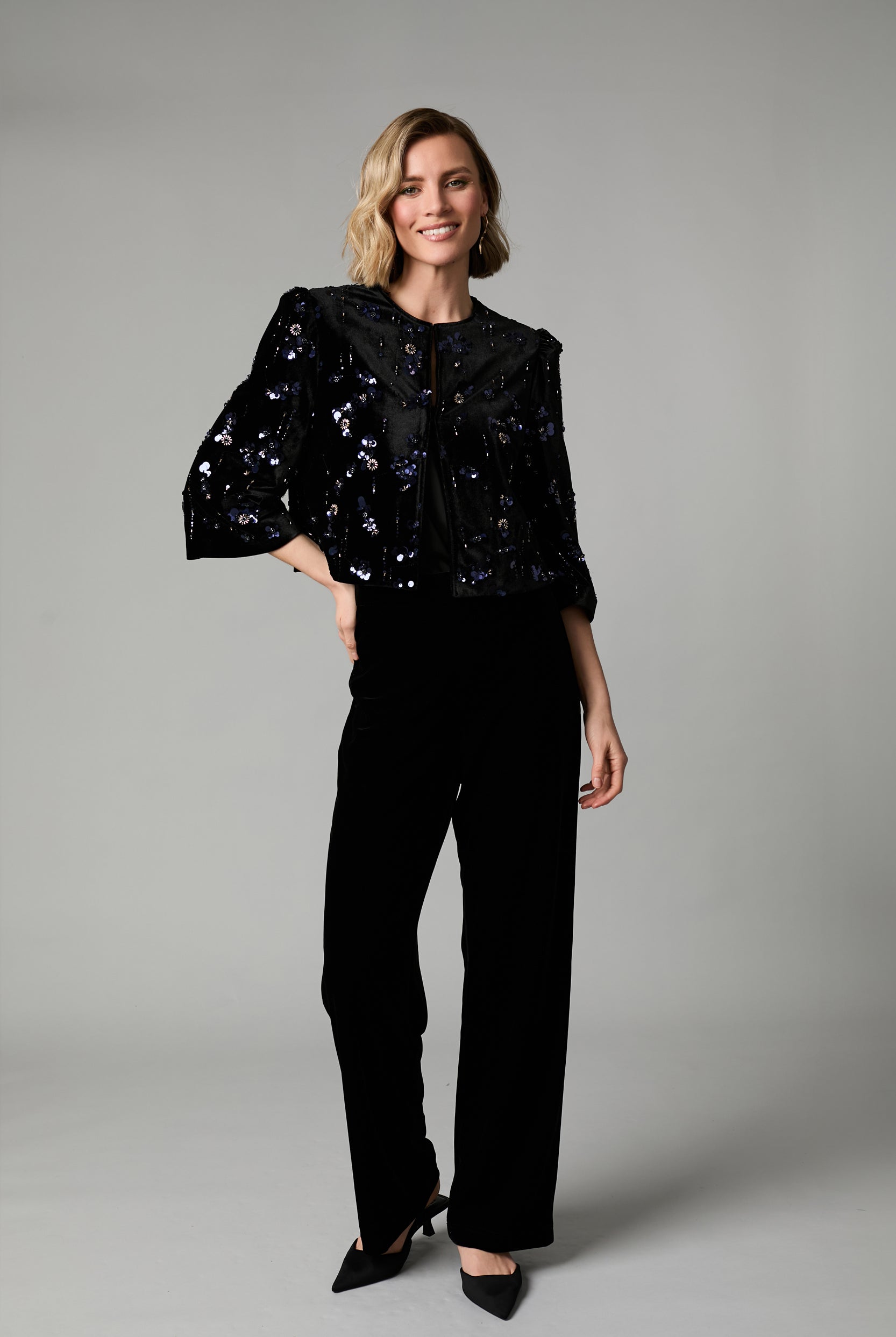 Fee G Jade black velvet occasion jacket styled on model with sequin embellishment