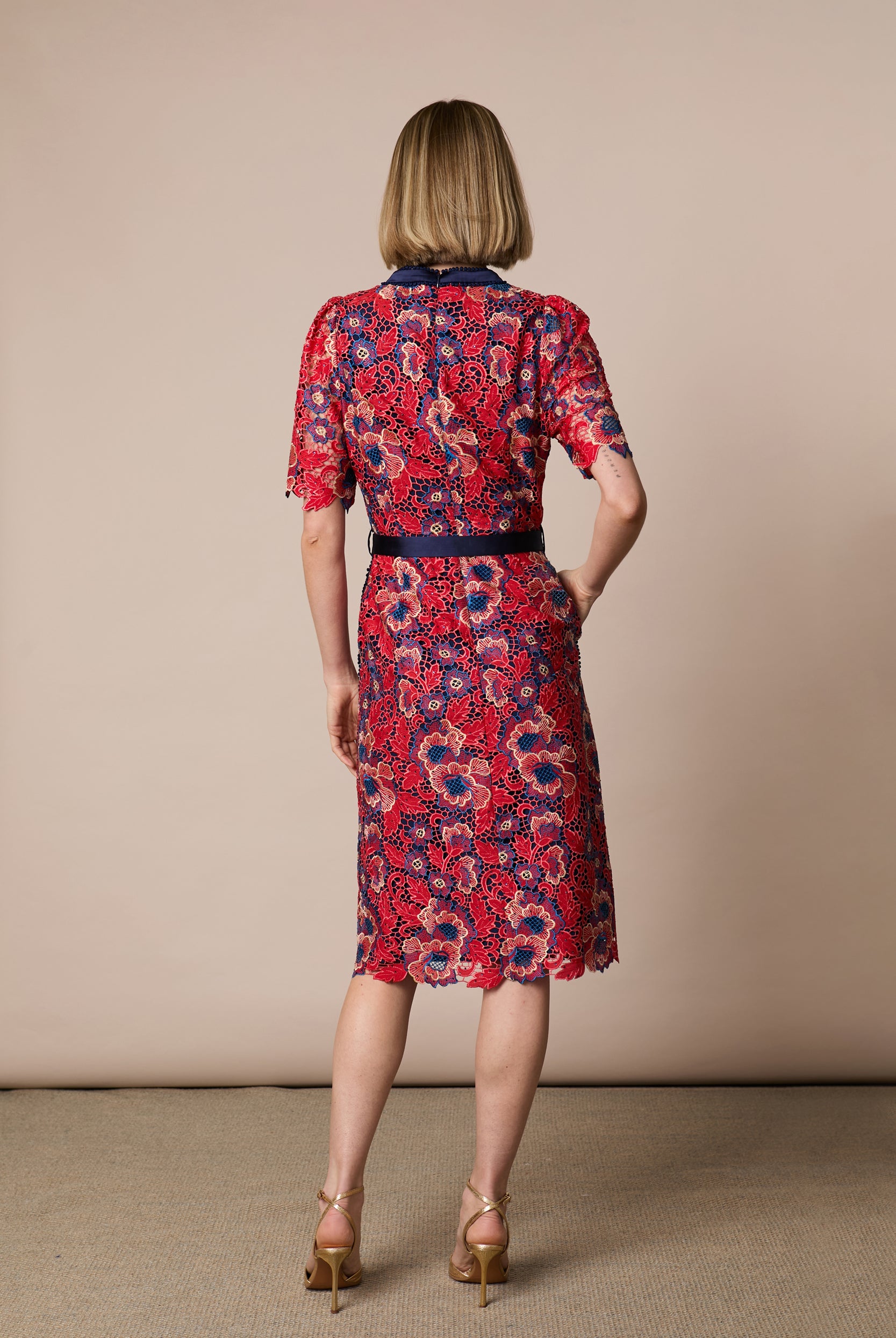 Back view of Fee G Stella red navy floral lace dress