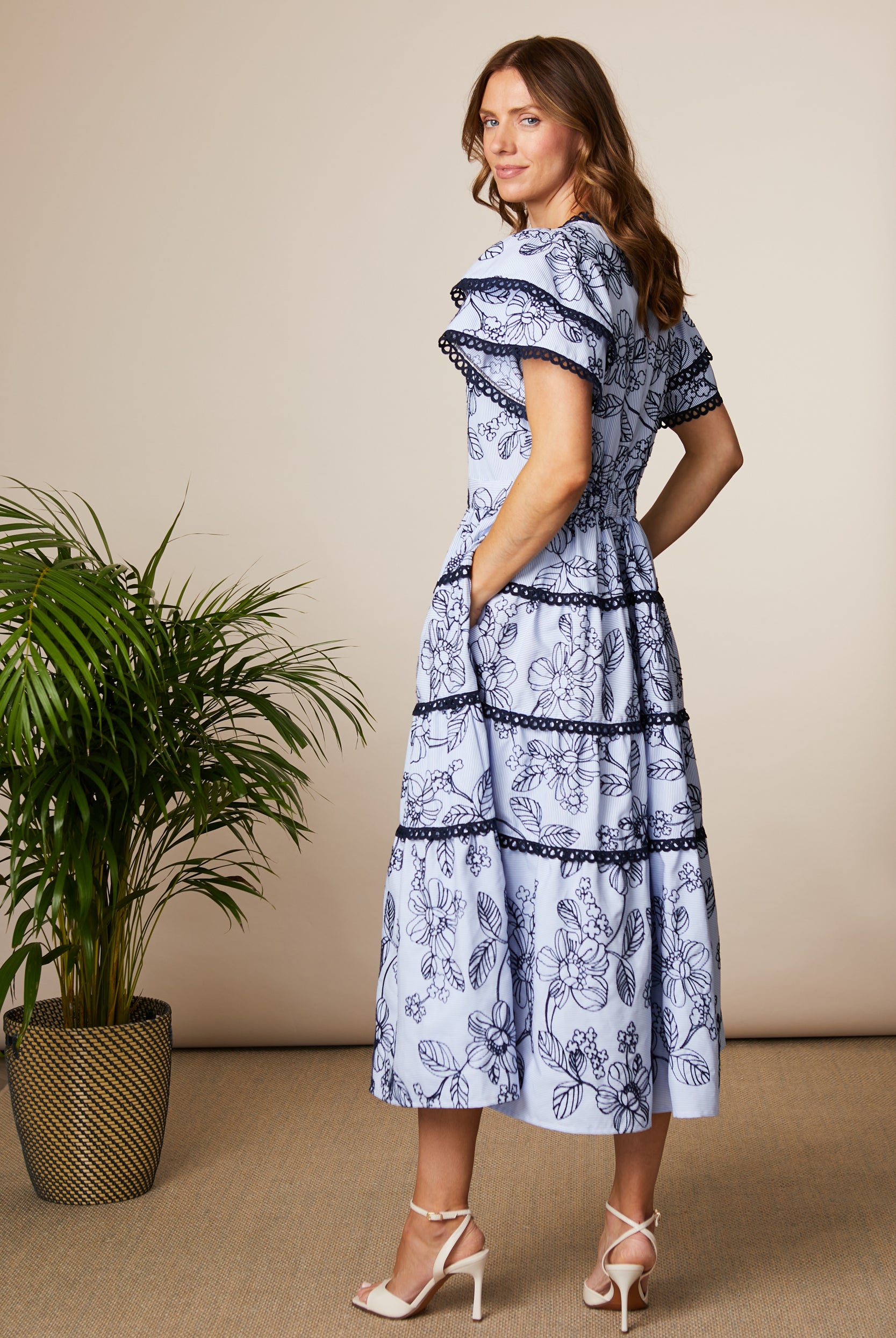 Fee G Lyra blue floral tiered midi dress with pockets back view