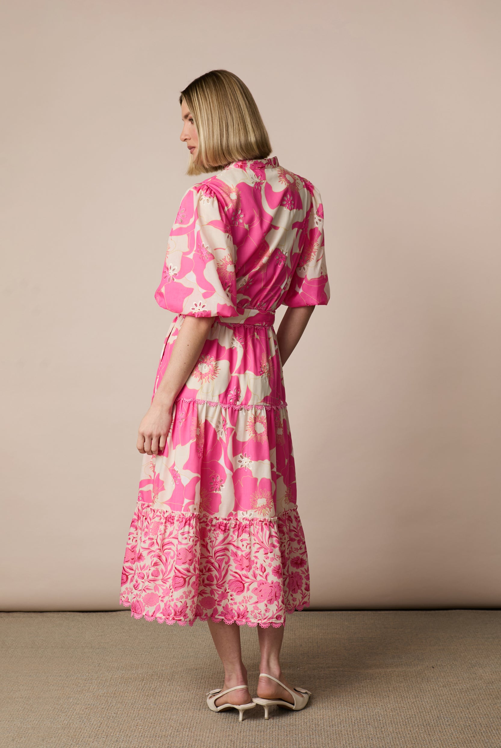 Back view of Fee G Eve pink floral tiered midi dress