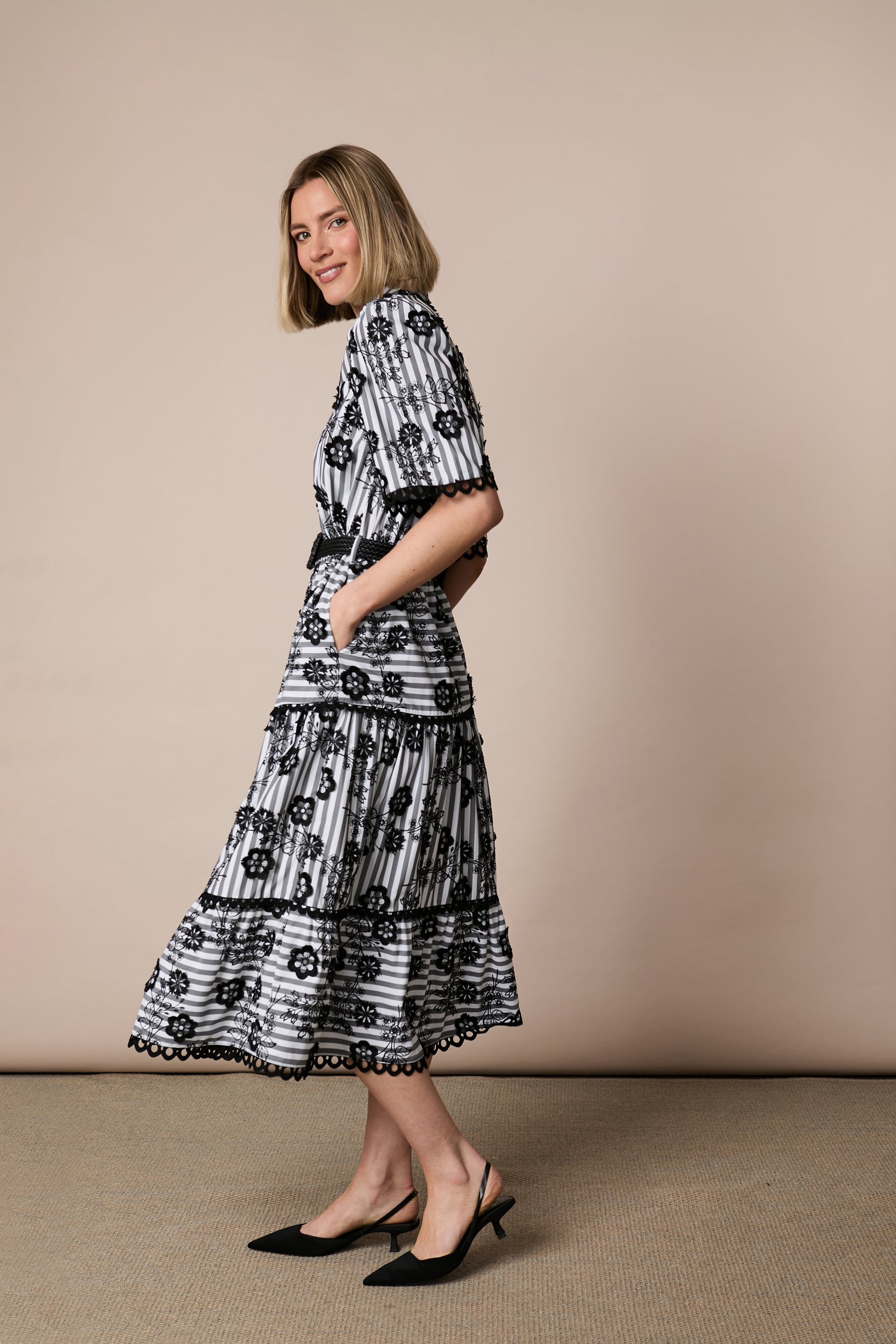 Fee G June black and white tiered midi dress side view with pockets