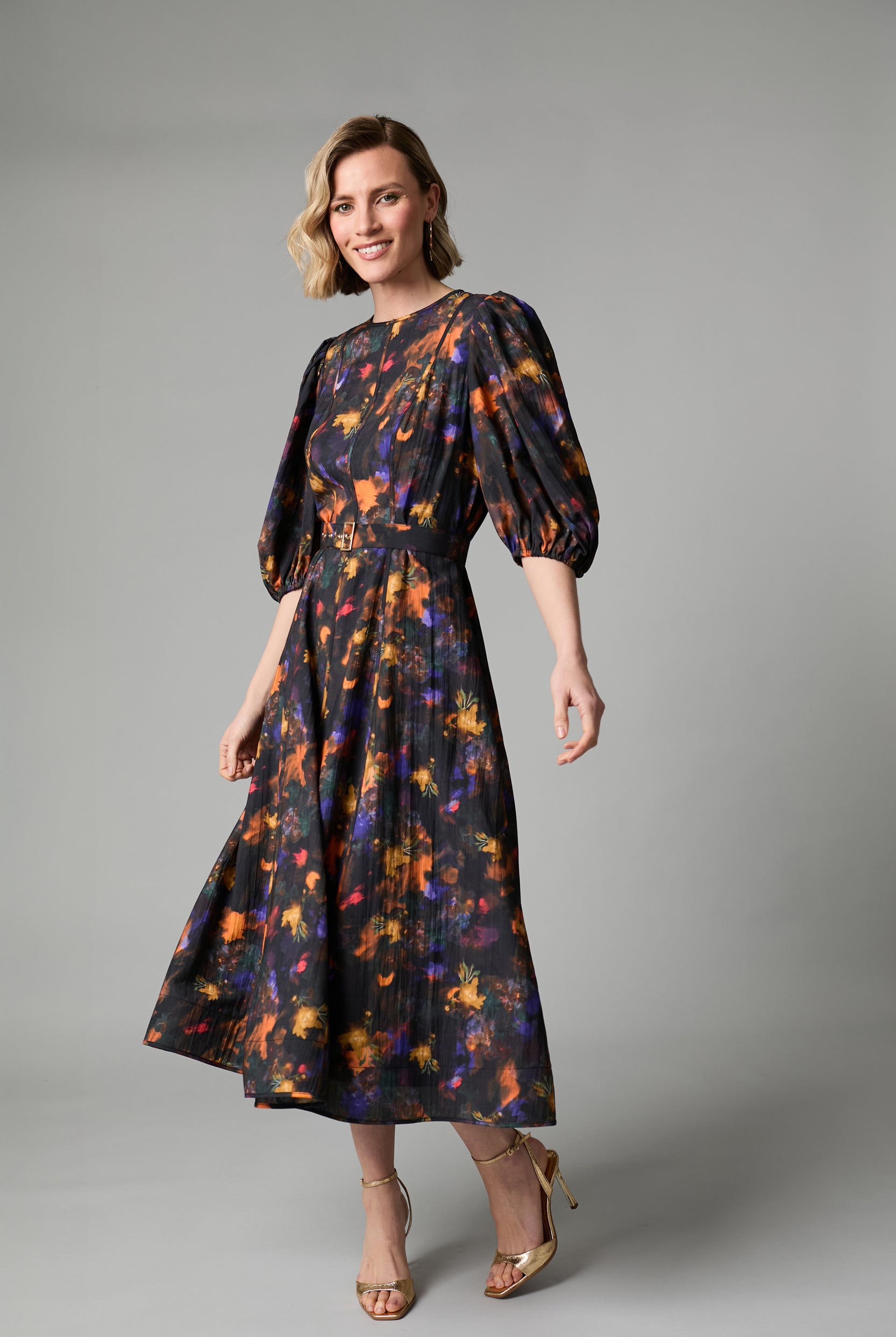Fee G Kate black floral midi dress shown from a three-quarter angle