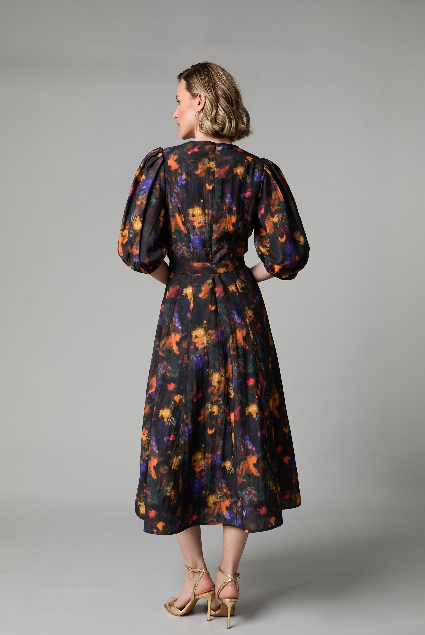 Back view of Fee G Kate black floral puff sleeve midi dress