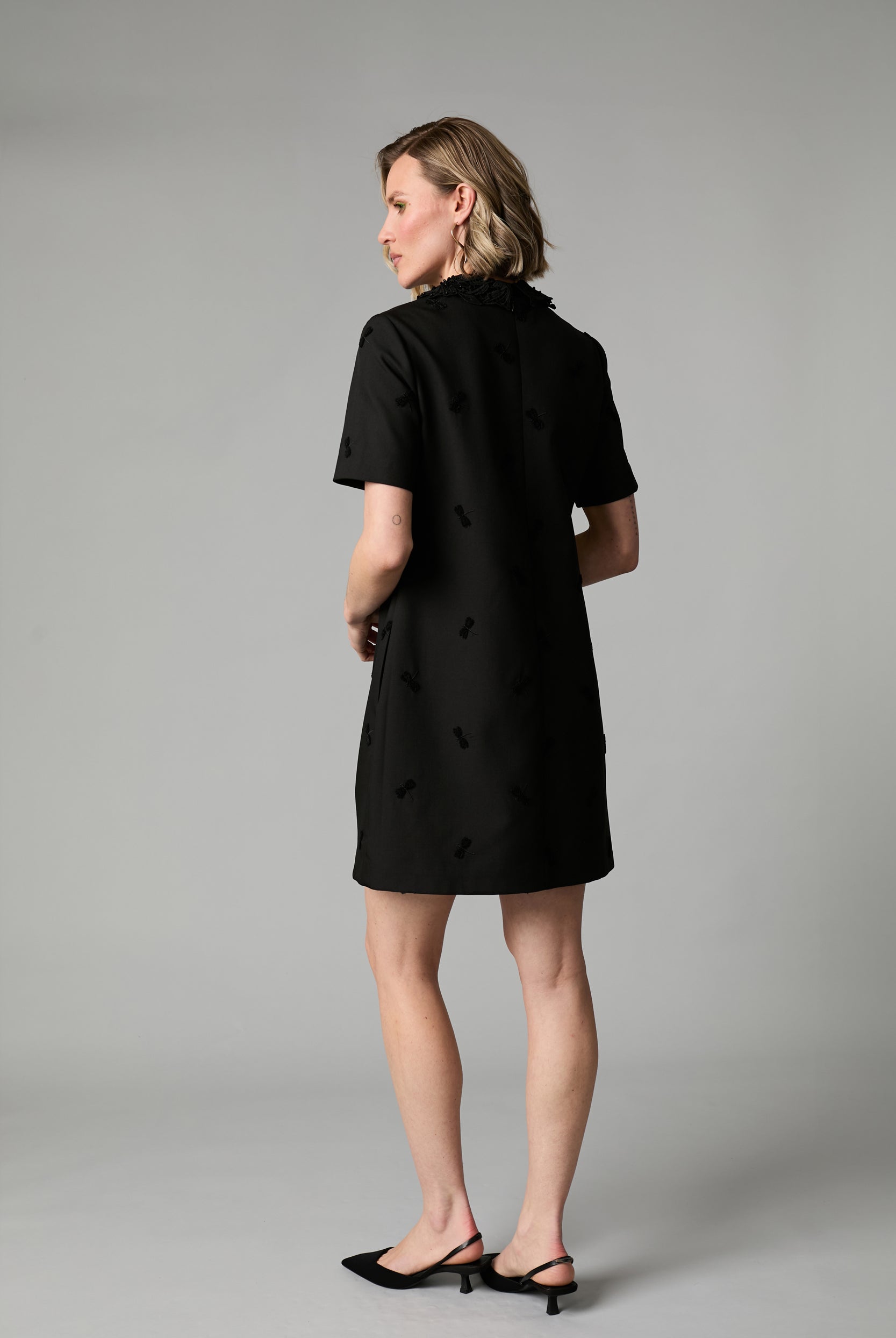 Fee G Dragonfly black short sleeve mini dress back view