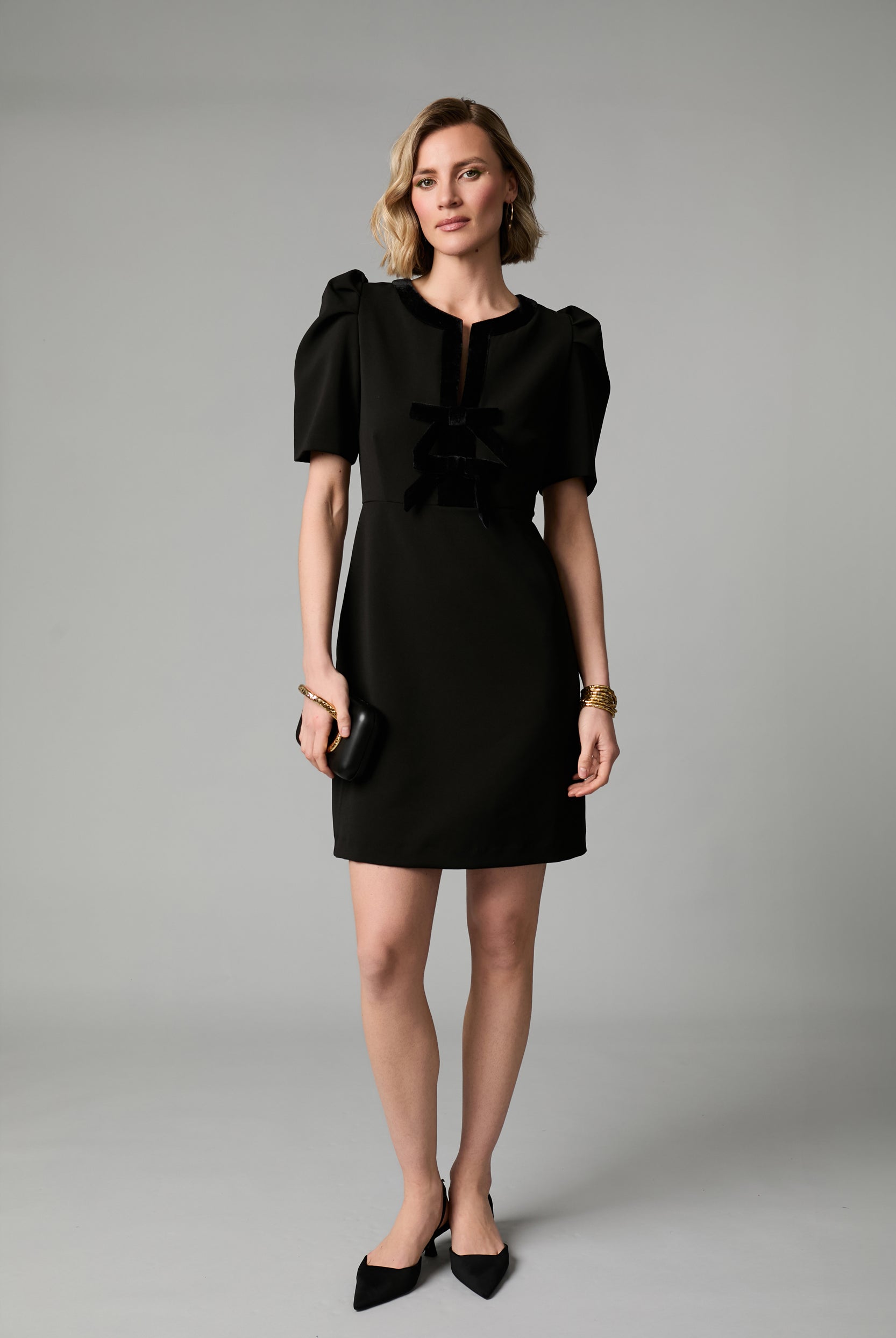 Fee G Sara black velvet bow detail mini dress styled for occasion wear