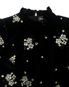 Close-up of beadwork and frilled collar on Fee G Astrid dress