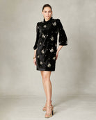 Model wearing Fee G Astrid black velvet beaded mini dress