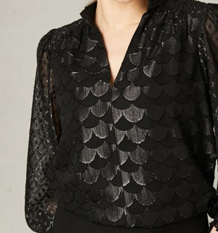 Close-up of dragonscale jacquard fabric with subtle lurex sparkle