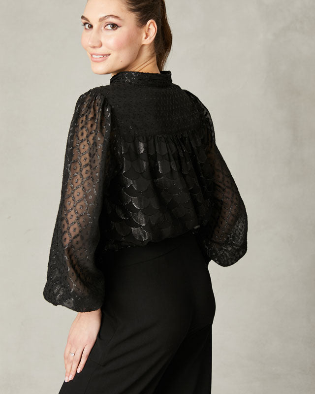 Back view of Fee G black jacquard lurex blouse with sheer long sleeves