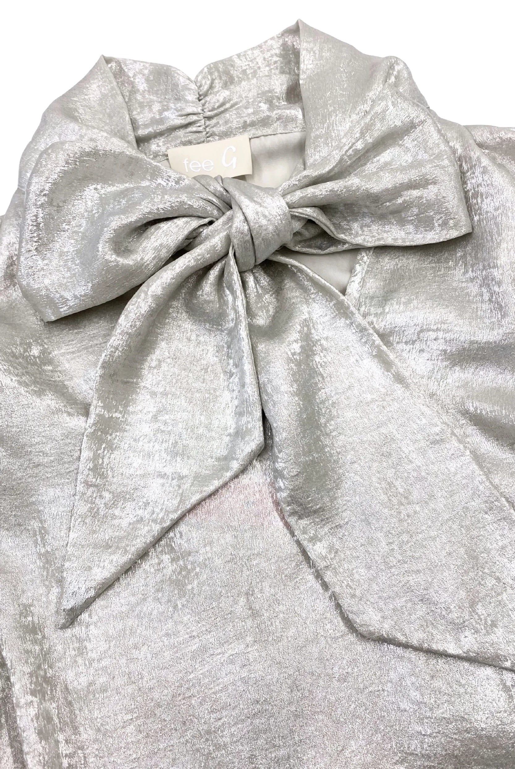 Fee G Amy silky occasion blouse close-up showing statement bow detail