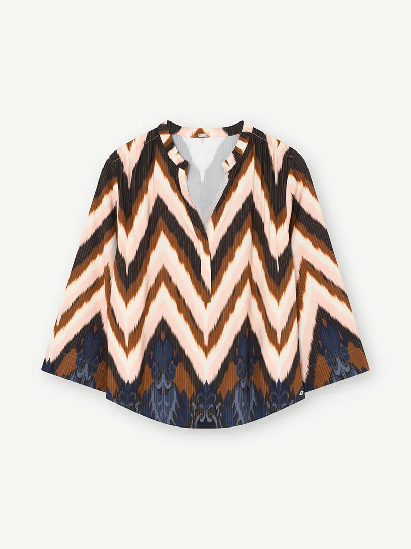 Flat lay of Gustav Sikka loose fit blouse in cream, blush and blue chevron print